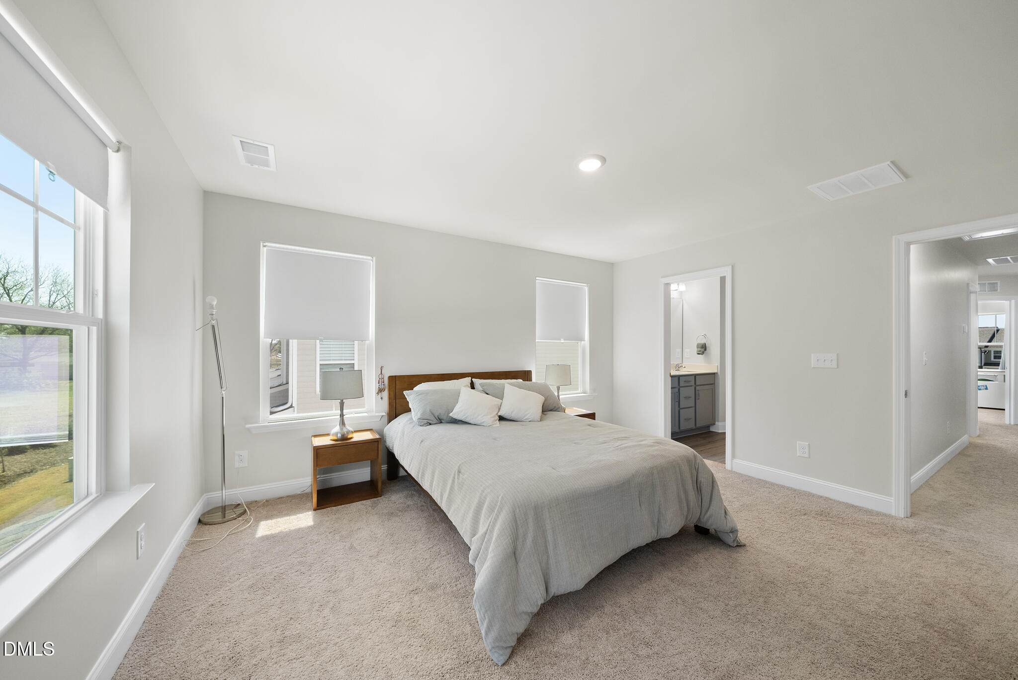 53 Bibury Way Angier, NC 27501 - Photo 26 of 50 a spacious bedroom with a bed and a large window