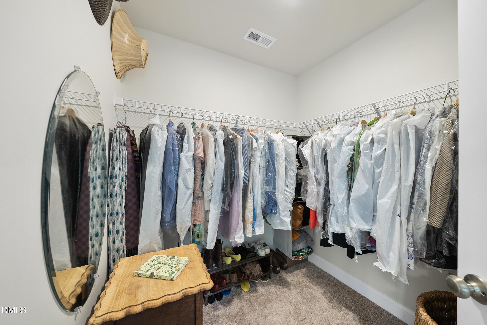 53 Bibury Way Angier, NC 27501 - Photo 28 of 50 a view of walk in closet with clothes