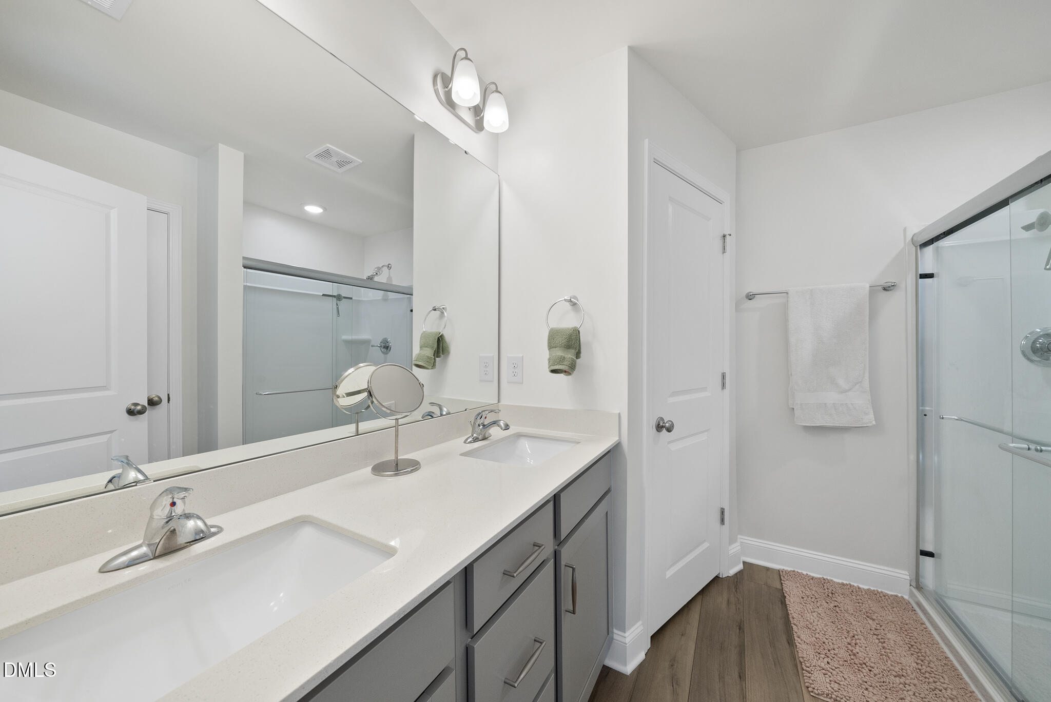 53 Bibury Way Angier, NC 27501 - Photo 29 of 50 a bathroom with a double vanity sink mirror and double