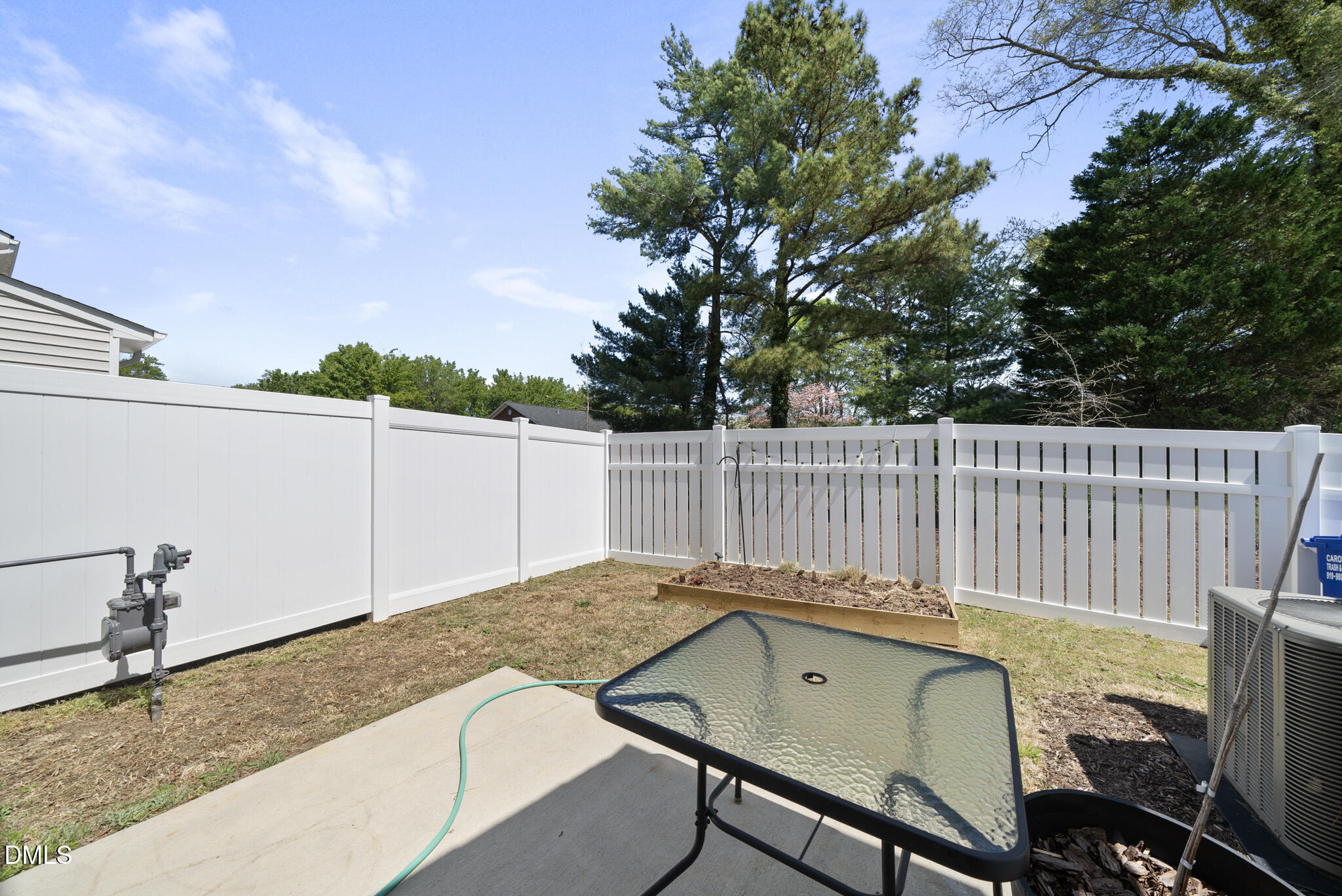 53 Bibury Way Angier, NC 27501 - Photo 32 of 50 a view of a roof deck with wooden fence and a couple of chairs