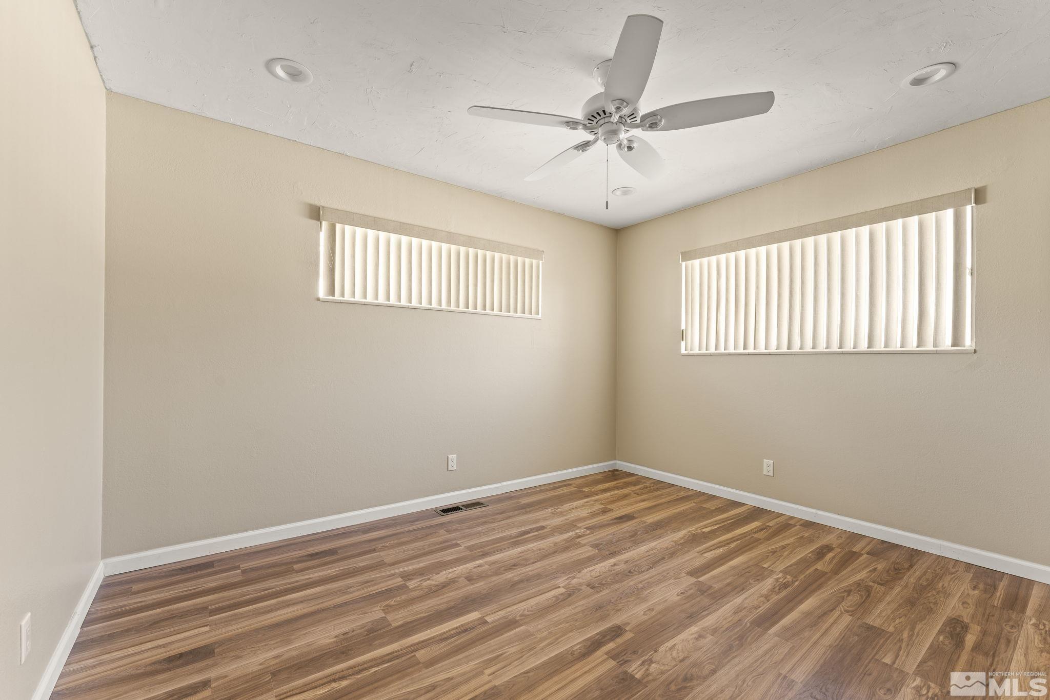 951 Wilkinson Avenue Reno, NV 89502 - Photo 17 of 25 a view of a room with wooden floor and fan