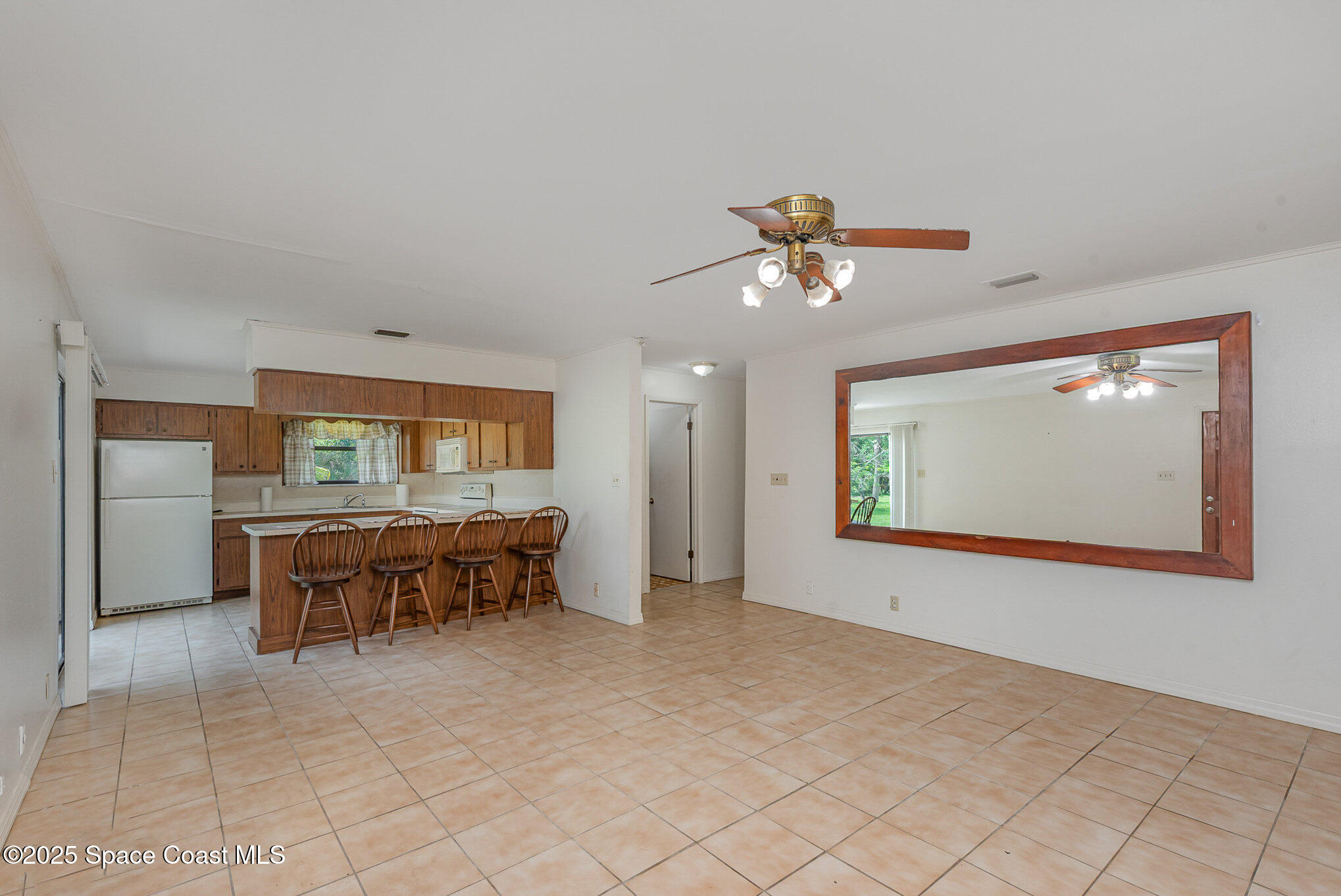4300 Justa Road Mims, FL 32754 - Photo 11 of 55 a view of a livingroom with furniture and chandelier fan