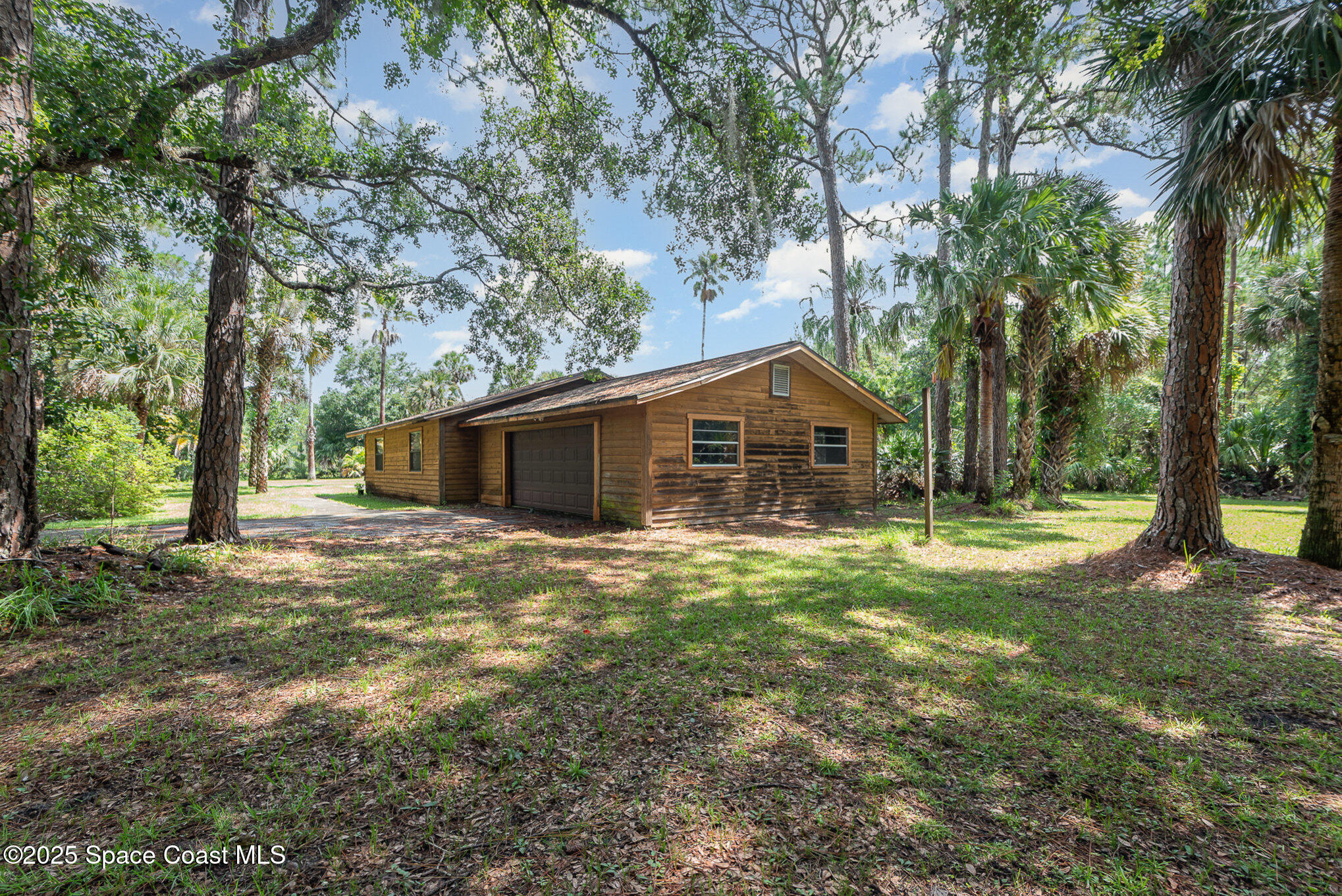 4300 Justa Road Mims, FL 32754 - Photo 24 of 55 a front view of a house with a yard