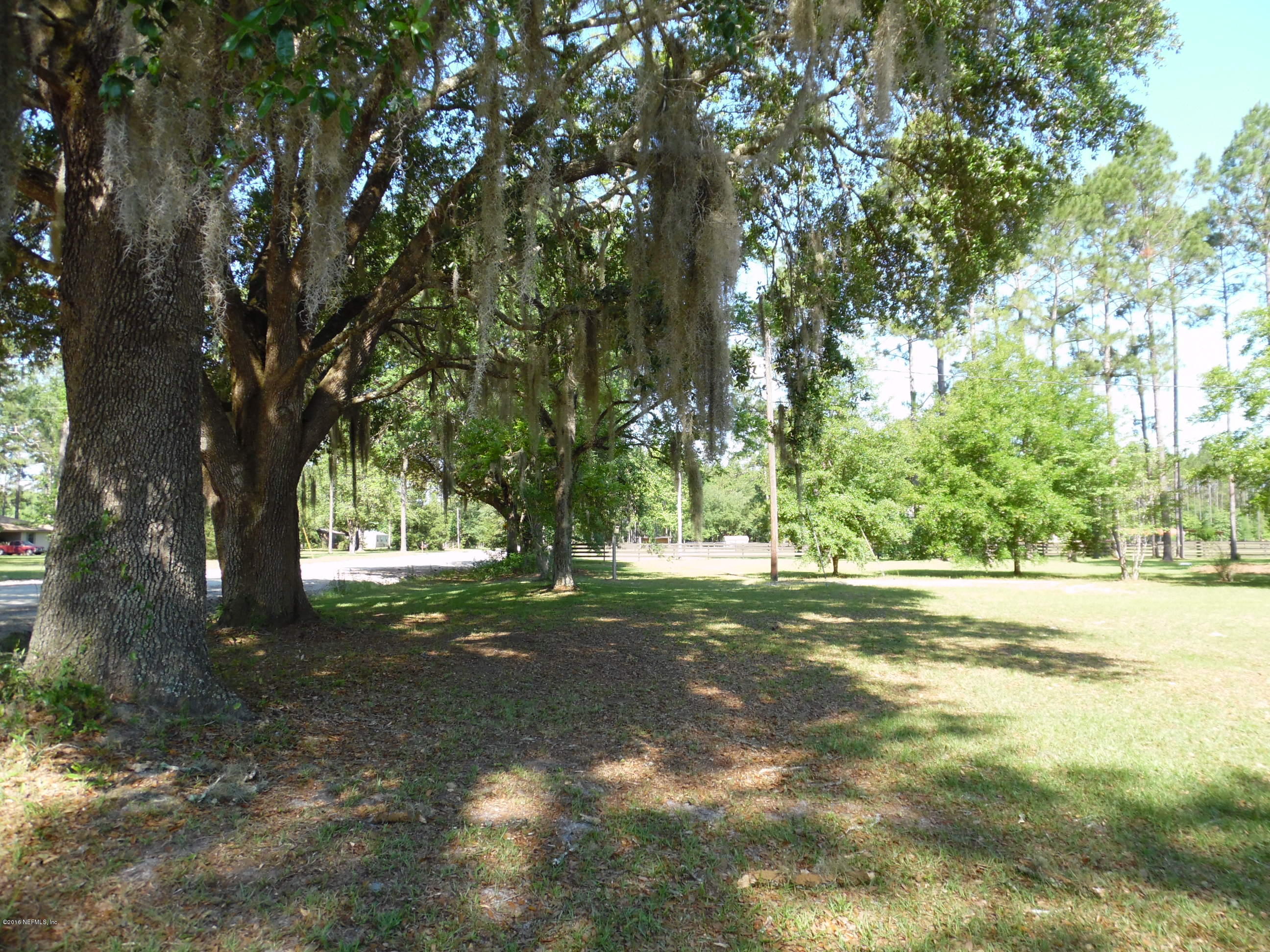 19484 Kenny Conner Road Hilliard, FL 32046 - Photo 28 of 31 BEAUTIFUL OAKS SHADE SOUTH PROPERTY LINE