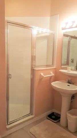 a view of a balcony with two chairs and a table