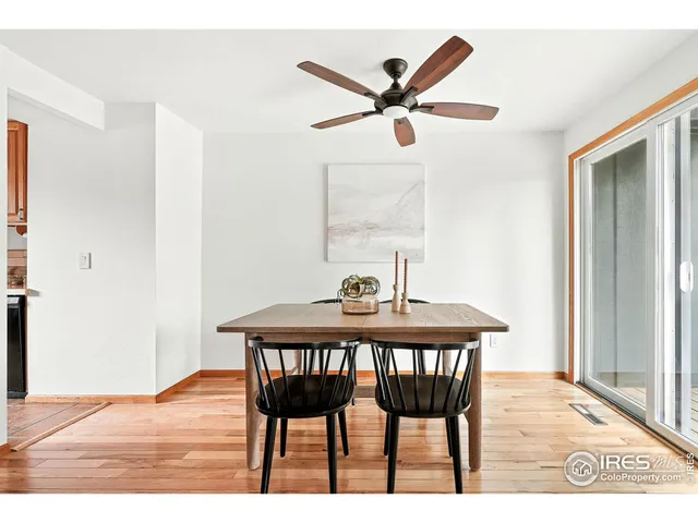 a view of a dining room with a table and chairs