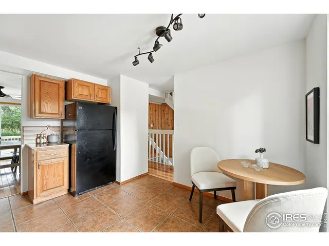 a kitchen with stainless steel appliances kitchen island granite countertop a refrigerator and a stove top oven