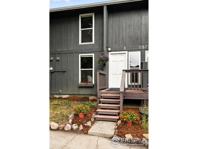 a backyard of a house with wooden floor and a sink