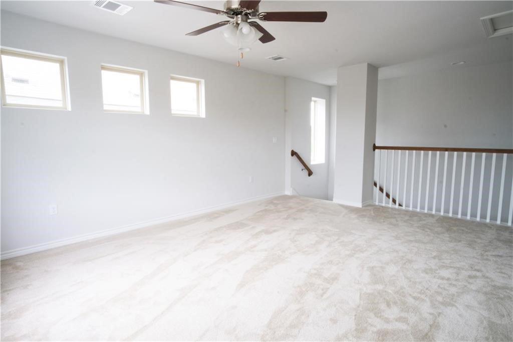 14110 McCoy Loop Austin, TX 78717 - Photo 13 of 35 a view of a livingroom with a ceiling fan and window