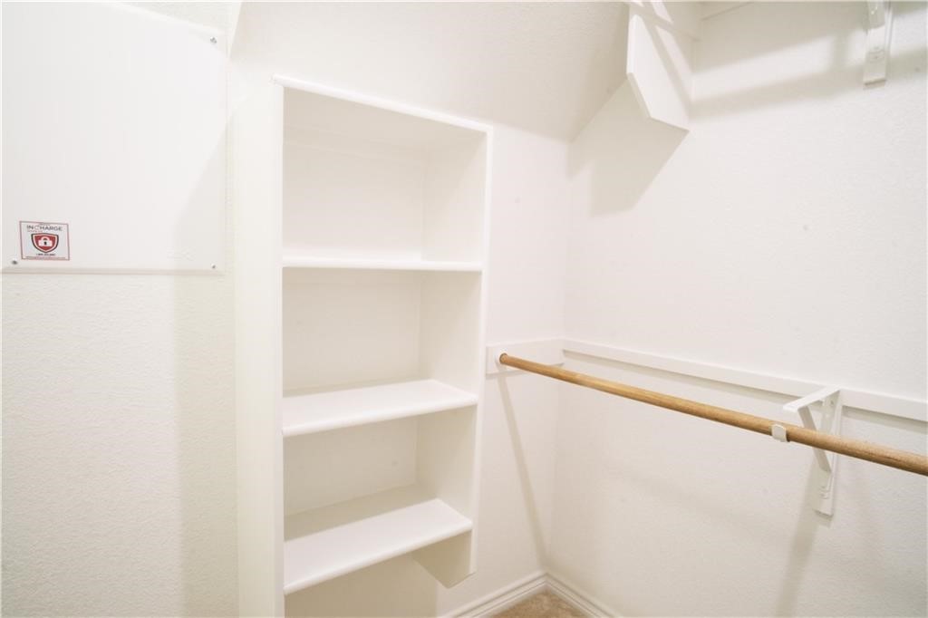 14110 McCoy Loop Austin, TX 78717 - Photo 14 of 35 a view of walk in closet with empty racks