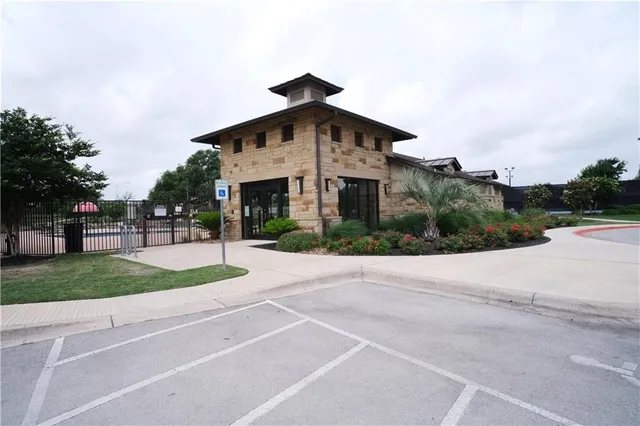 a white house with a yard and plants