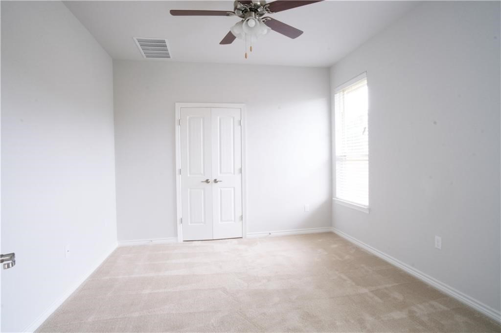 14110 McCoy Loop Austin, TX 78717 - Photo 21 of 35 an empty room with a window and ceiling fan