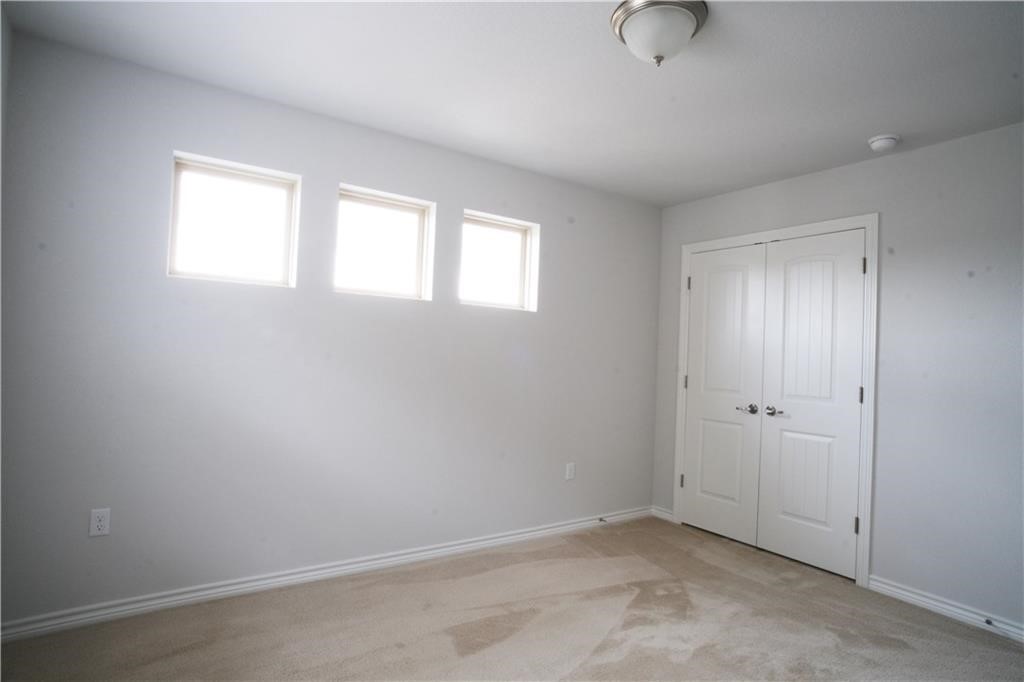 14110 McCoy Loop Austin, TX 78717 - Photo 8 of 35 an empty room with windows