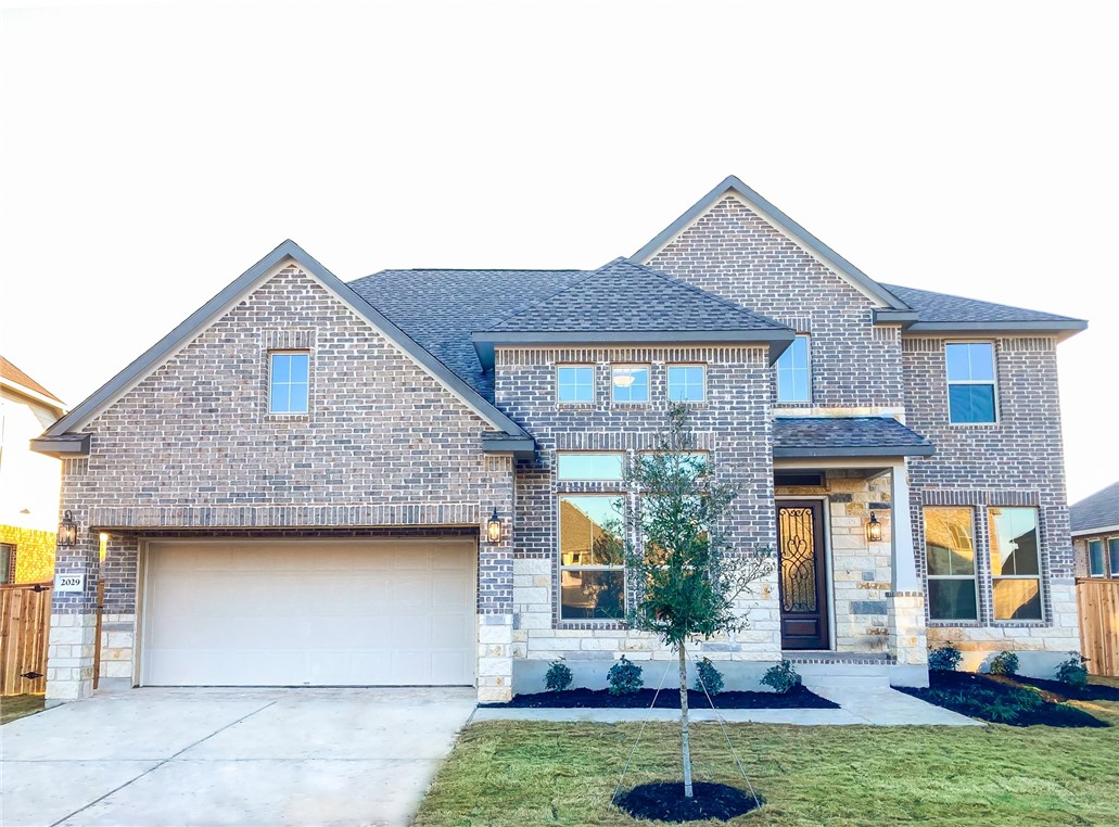 2029 Waterview Road Georgetown, TX 78628 - Photo 1 of 1 a front view of a house with garden