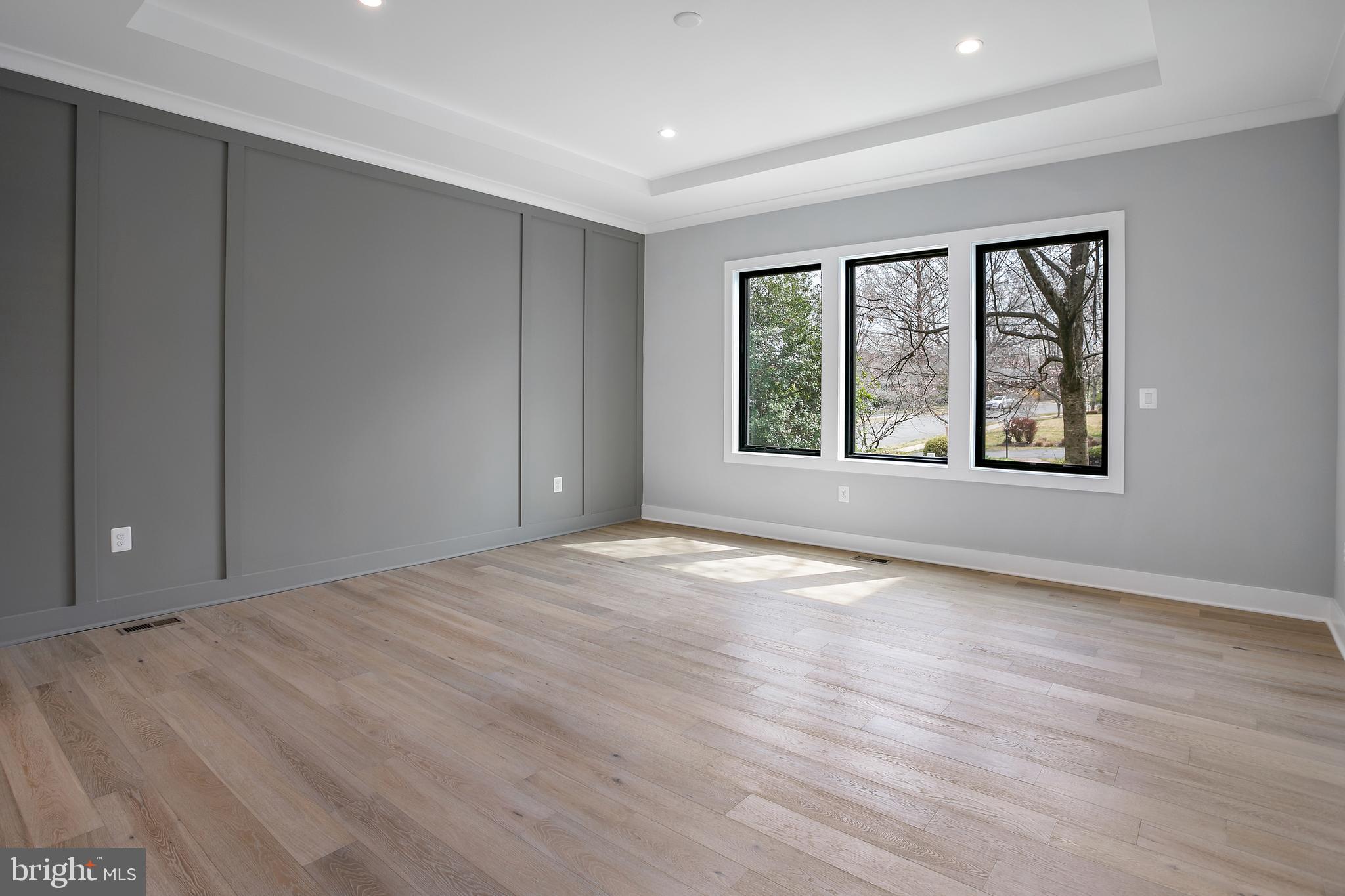 7019 Statendam Court McLean, VA 22101 - Photo 13 of 52 a view of an empty room with a window and wooden floor