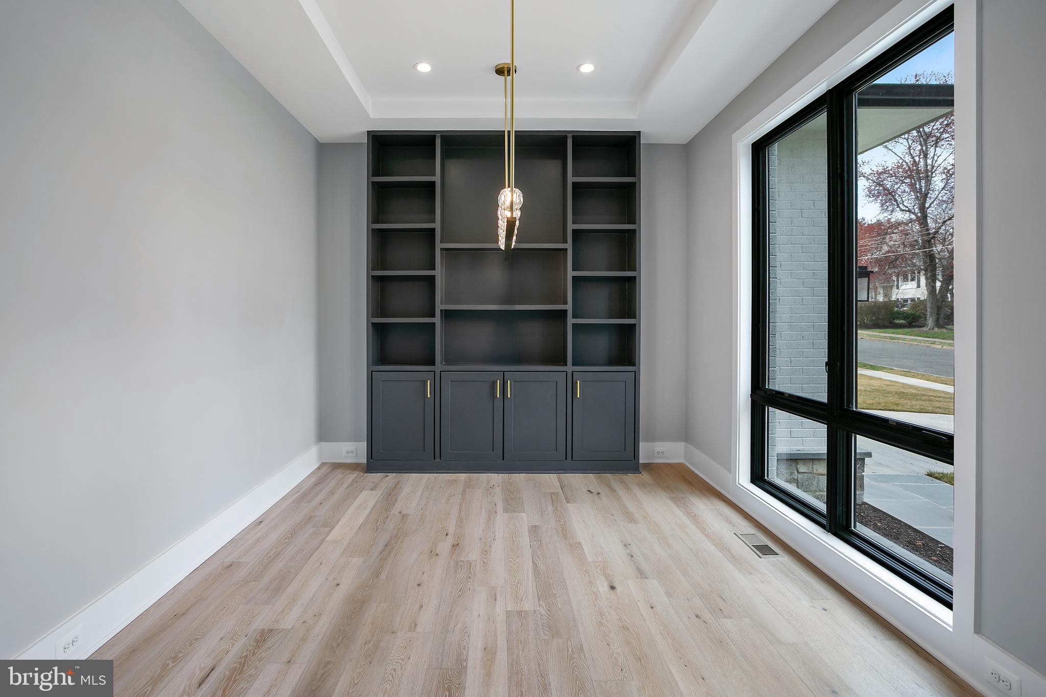 7019 Statendam Court McLean, VA 22101 - Photo 19 of 52 a view of an empty room with wooden floor and a window