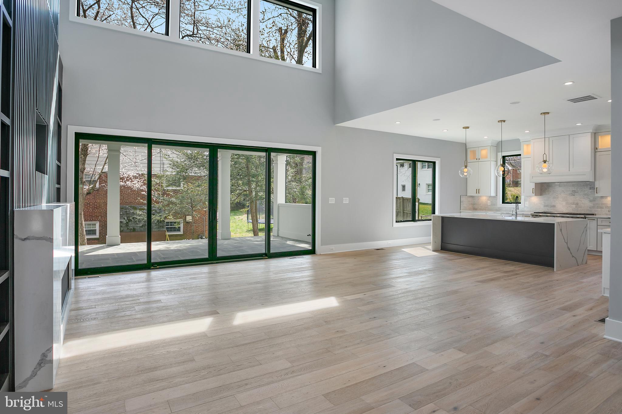 7019 Statendam Court McLean, VA 22101 - Photo 2 of 52 a view of an empty room with window and wooden floor