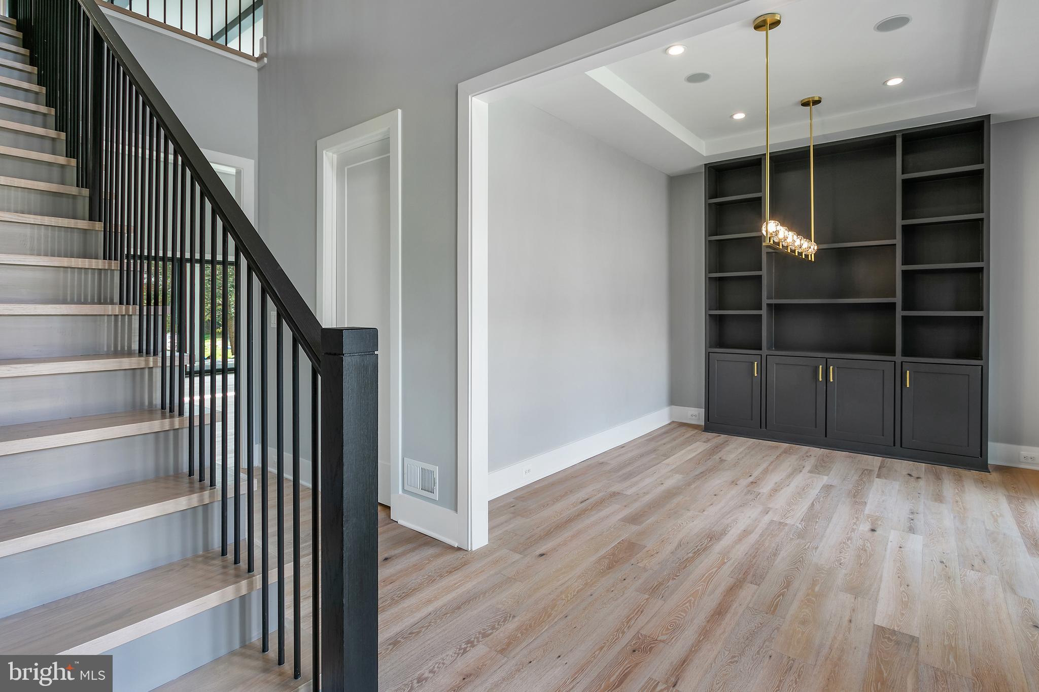 7019 Statendam Court McLean, VA 22101 - Photo 22 of 52 a view of an empty room with wooden floor and entryway