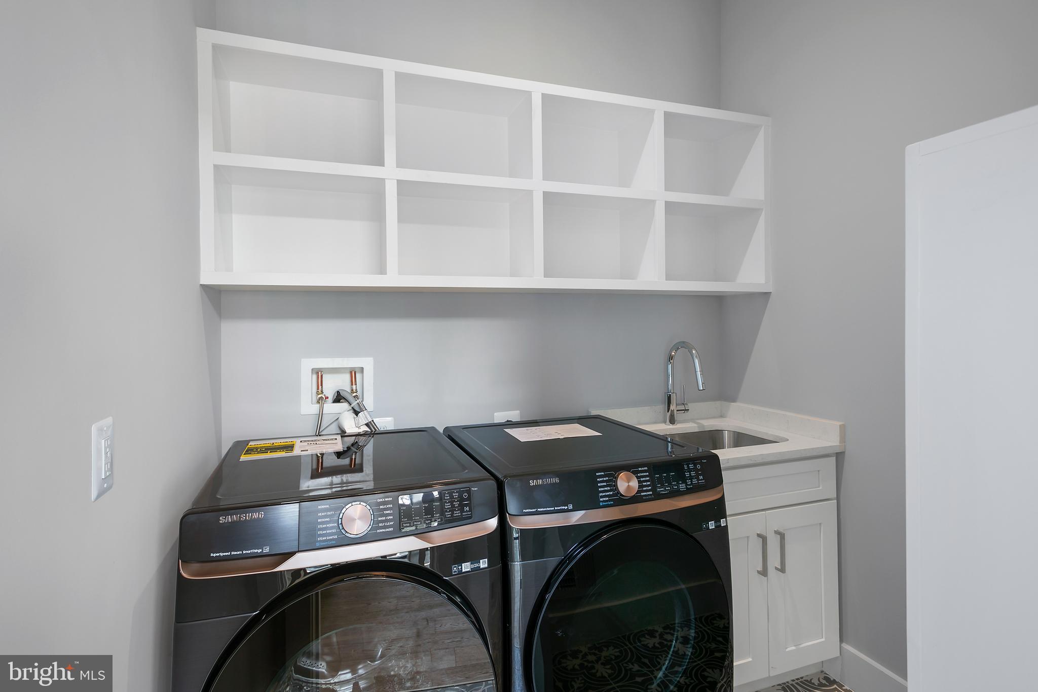 7019 Statendam Court McLean, VA 22101 - Photo 24 of 52 a utility room with sink dryer and washer