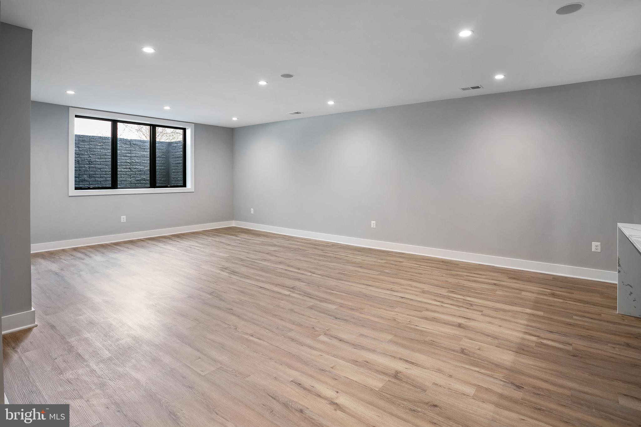 7019 Statendam Court McLean, VA 22101 - Photo 26 of 52 an empty room with wooden floor and windows