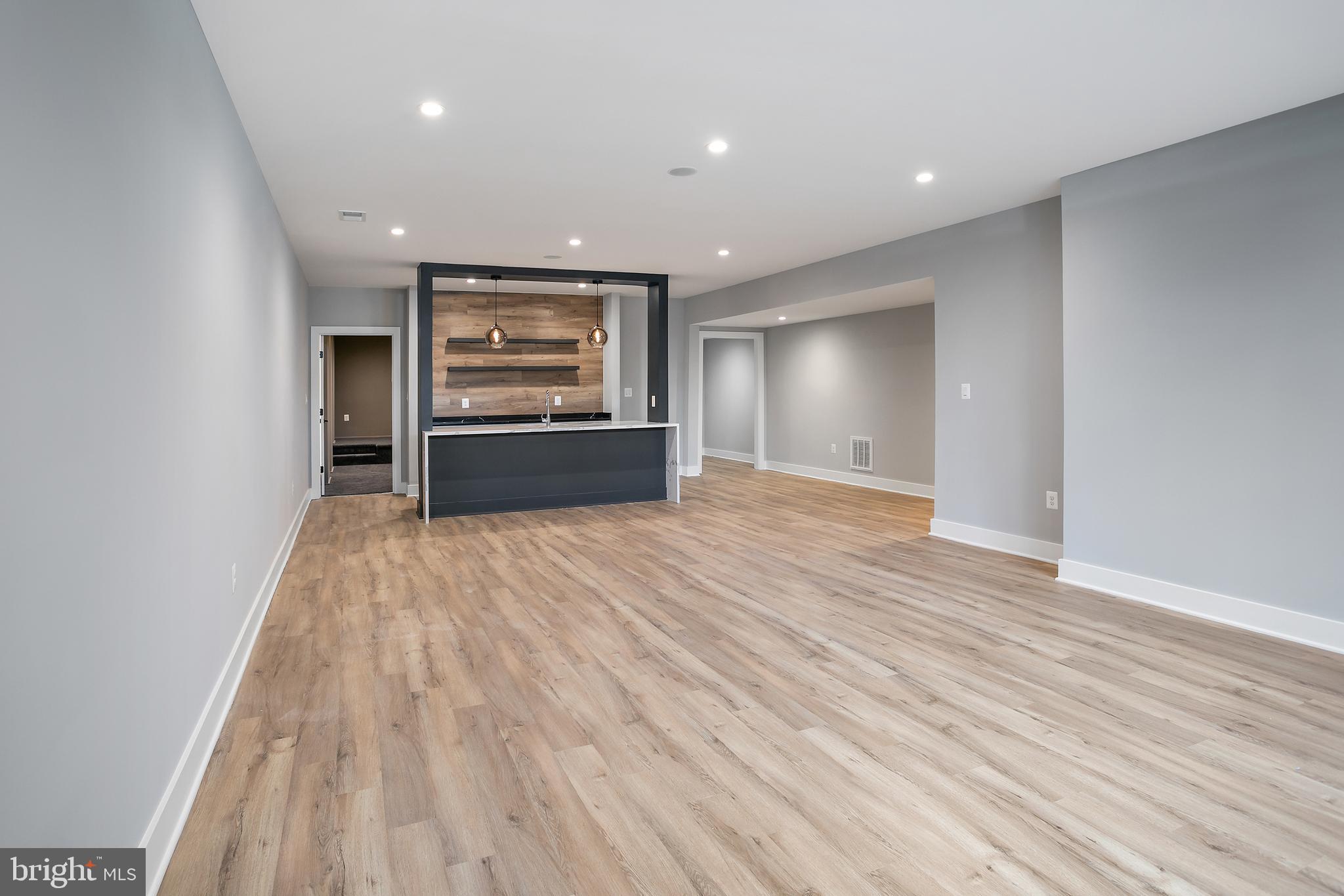 7019 Statendam Court McLean, VA 22101 - Photo 27 of 52 wooden floor in an empty room with a window