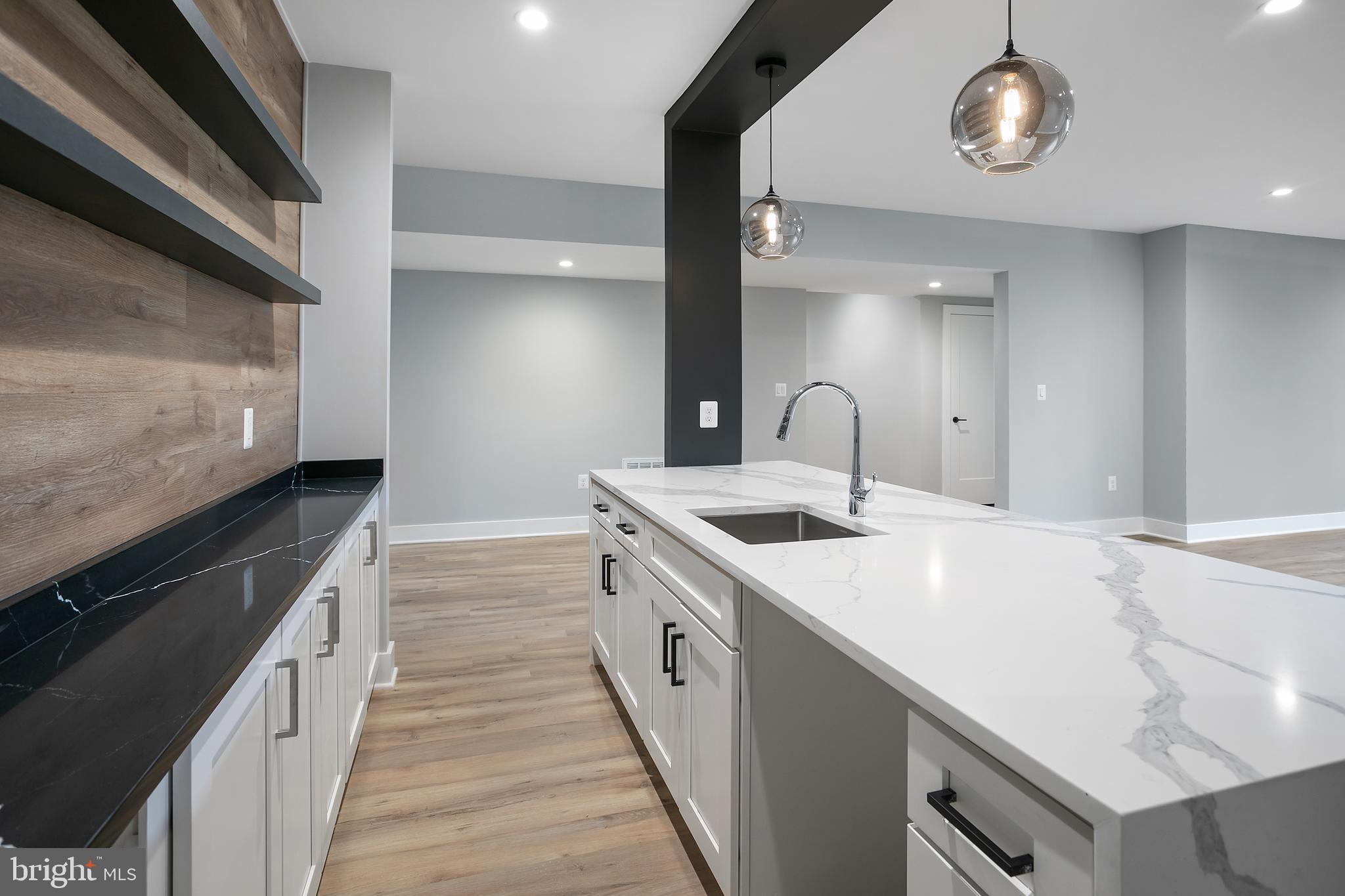 7019 Statendam Court McLean, VA 22101 - Photo 28 of 52 a kitchen with a sink and a stove
