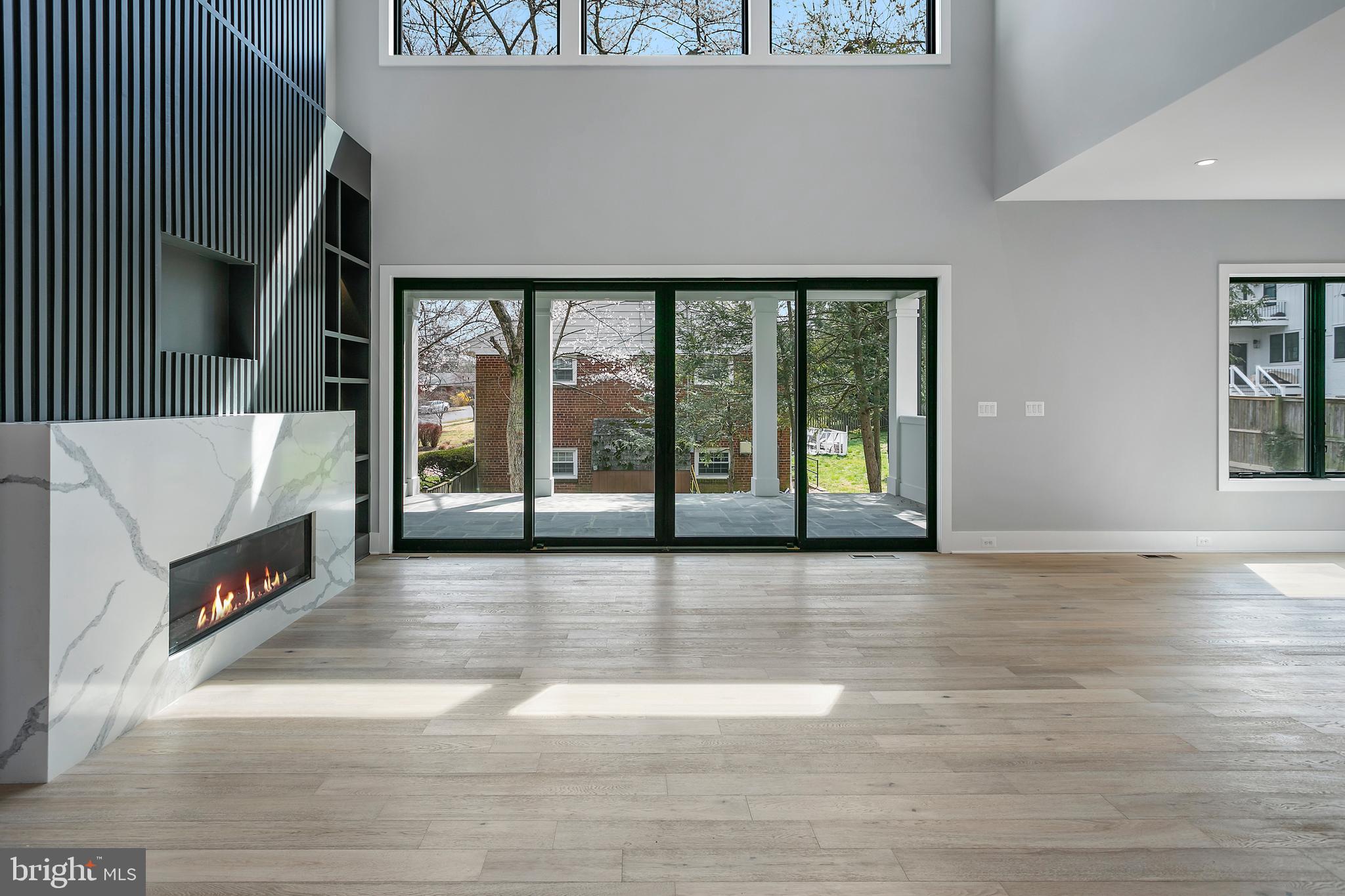 7019 Statendam Court McLean, VA 22101 - Photo 3 of 52 a view of an empty room with wooden floor and a window