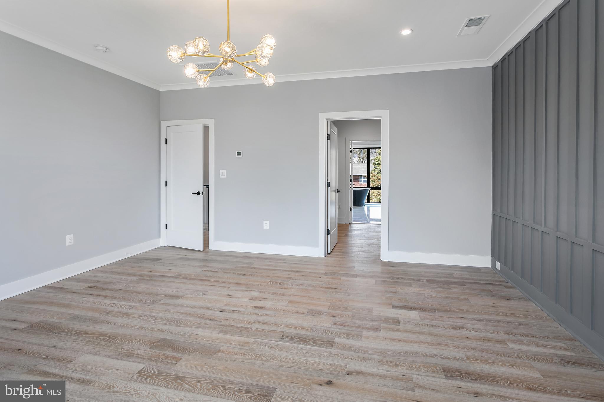 7019 Statendam Court McLean, VA 22101 - Photo 37 of 52 wooden floor in an empty room with a chandelier fan