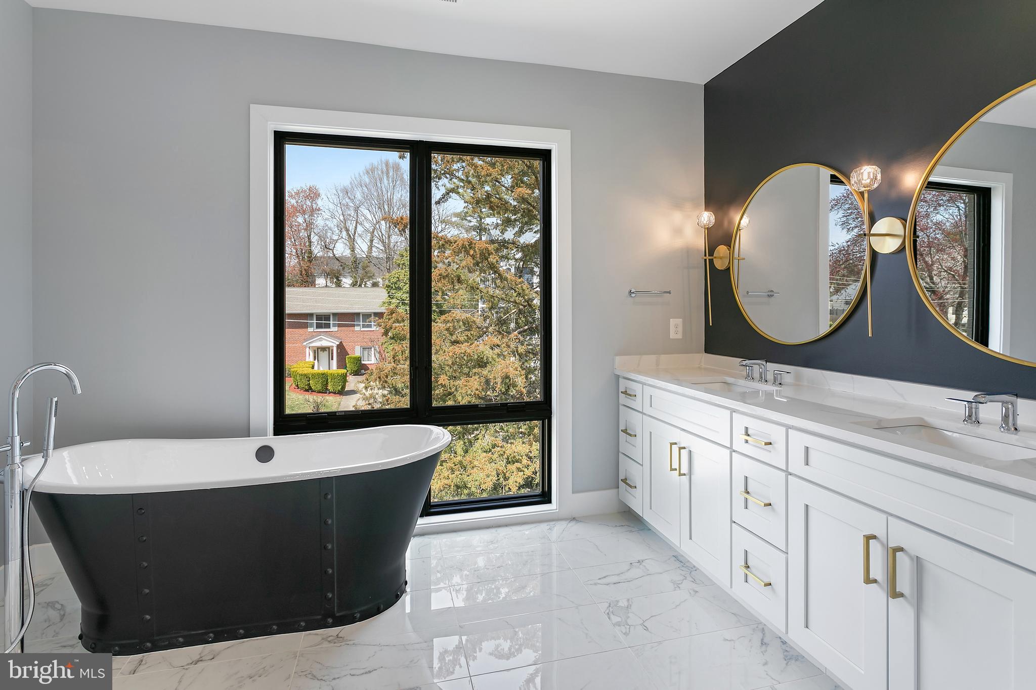7019 Statendam Court McLean, VA 22101 - Photo 39 of 52 a bathroom with a double vanity sink and a mirror