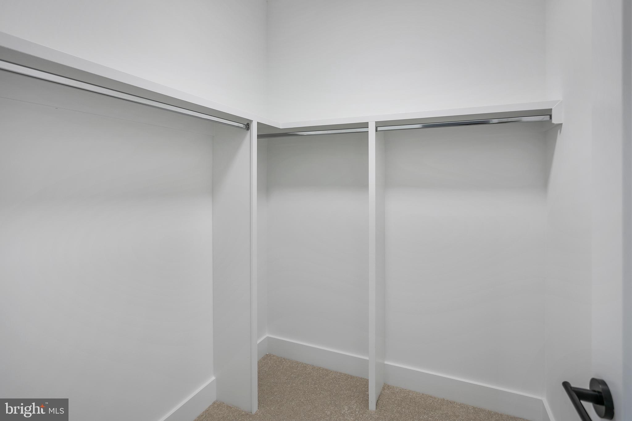 7019 Statendam Court McLean, VA 22101 - Photo 46 of 52 a view of walk in closet with empty racks