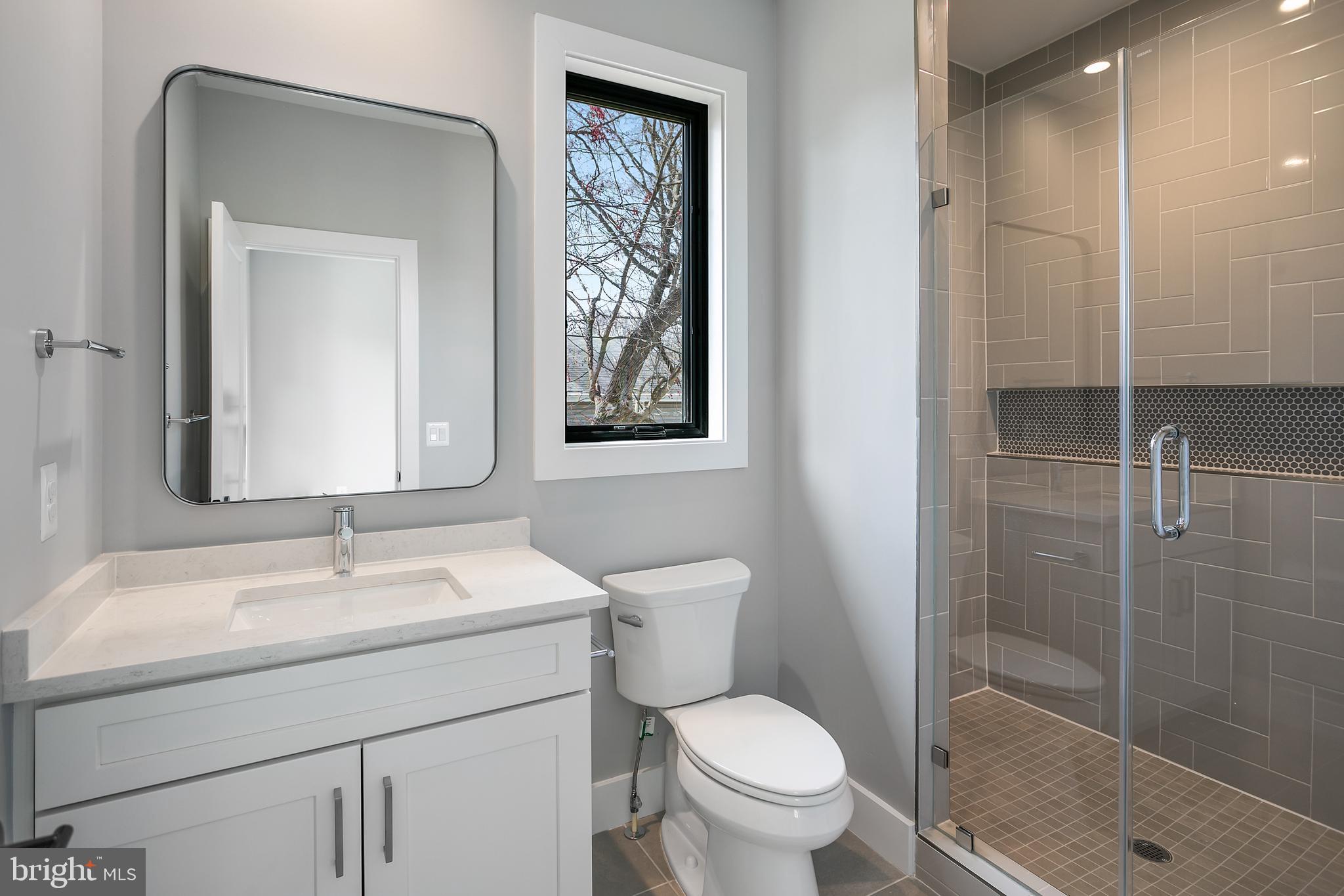 7019 Statendam Court McLean, VA 22101 - Photo 48 of 52 a bathroom with a toilet sink and shower