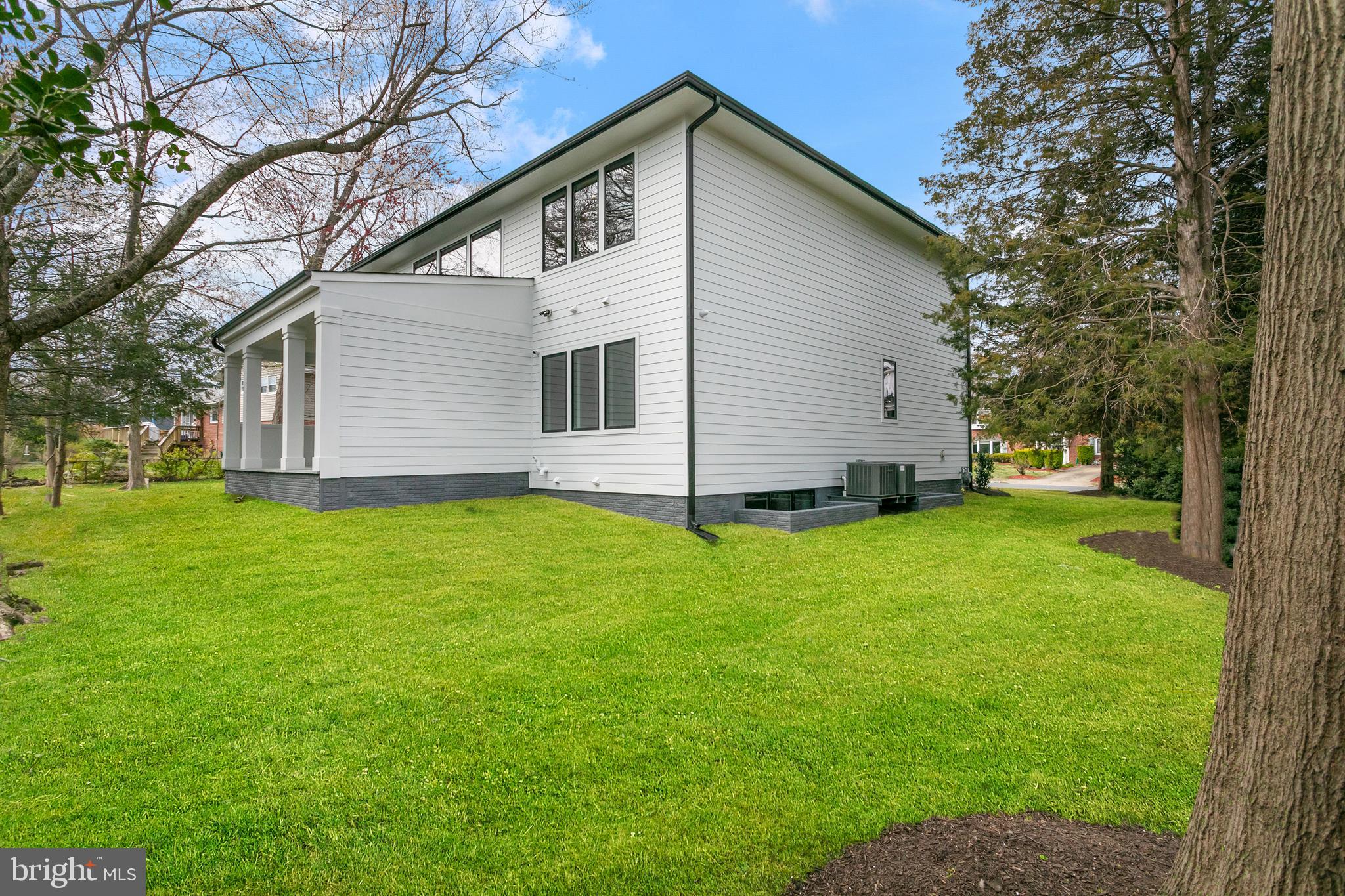 7019 Statendam Court McLean, VA 22101 - Photo 51 of 52 a view of a backyard with large trees plants and large tree