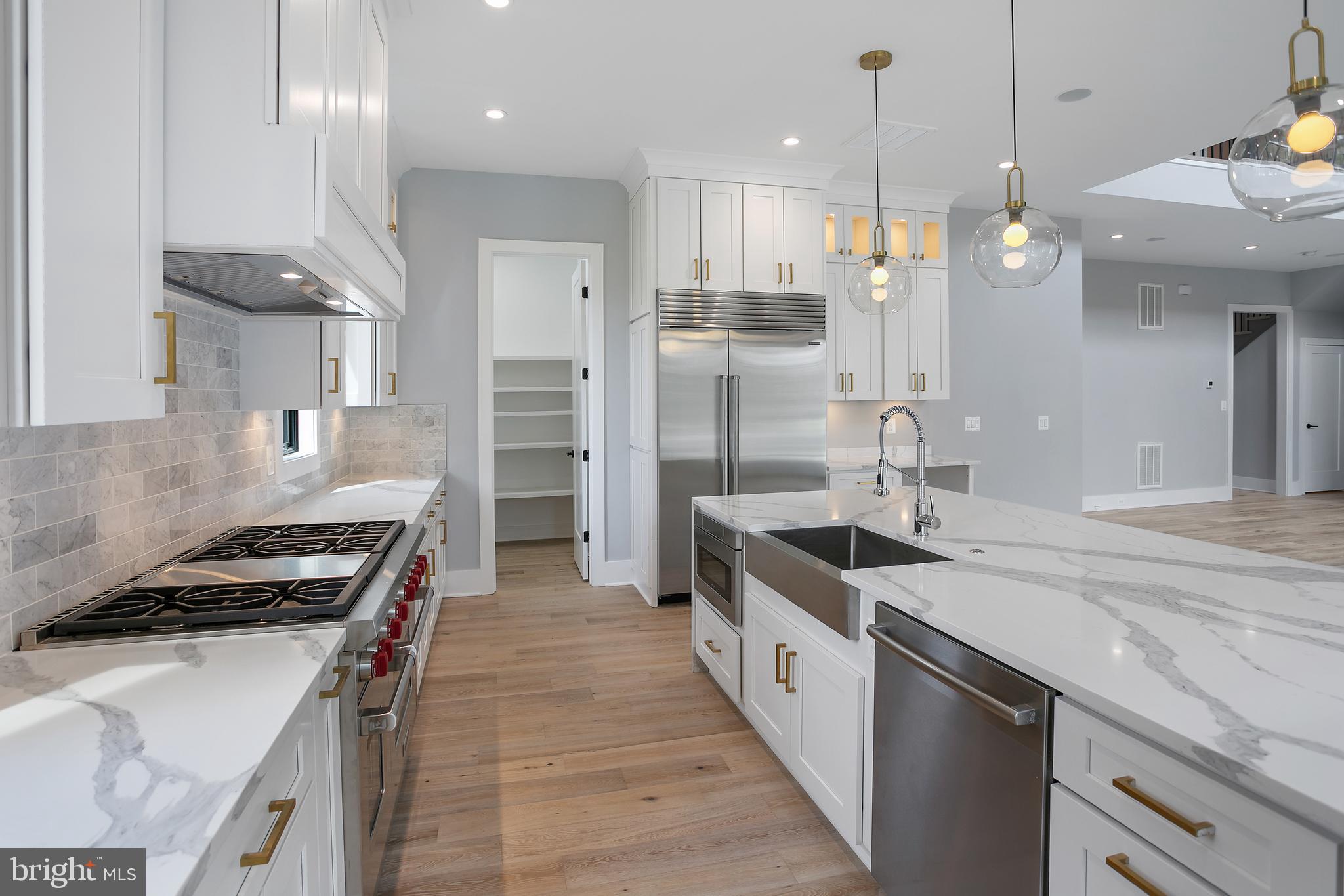 7019 Statendam Court McLean, VA 22101 - Photo 9 of 52 a kitchen with stainless steel appliances granite countertop a sink a stove and a refrigerator