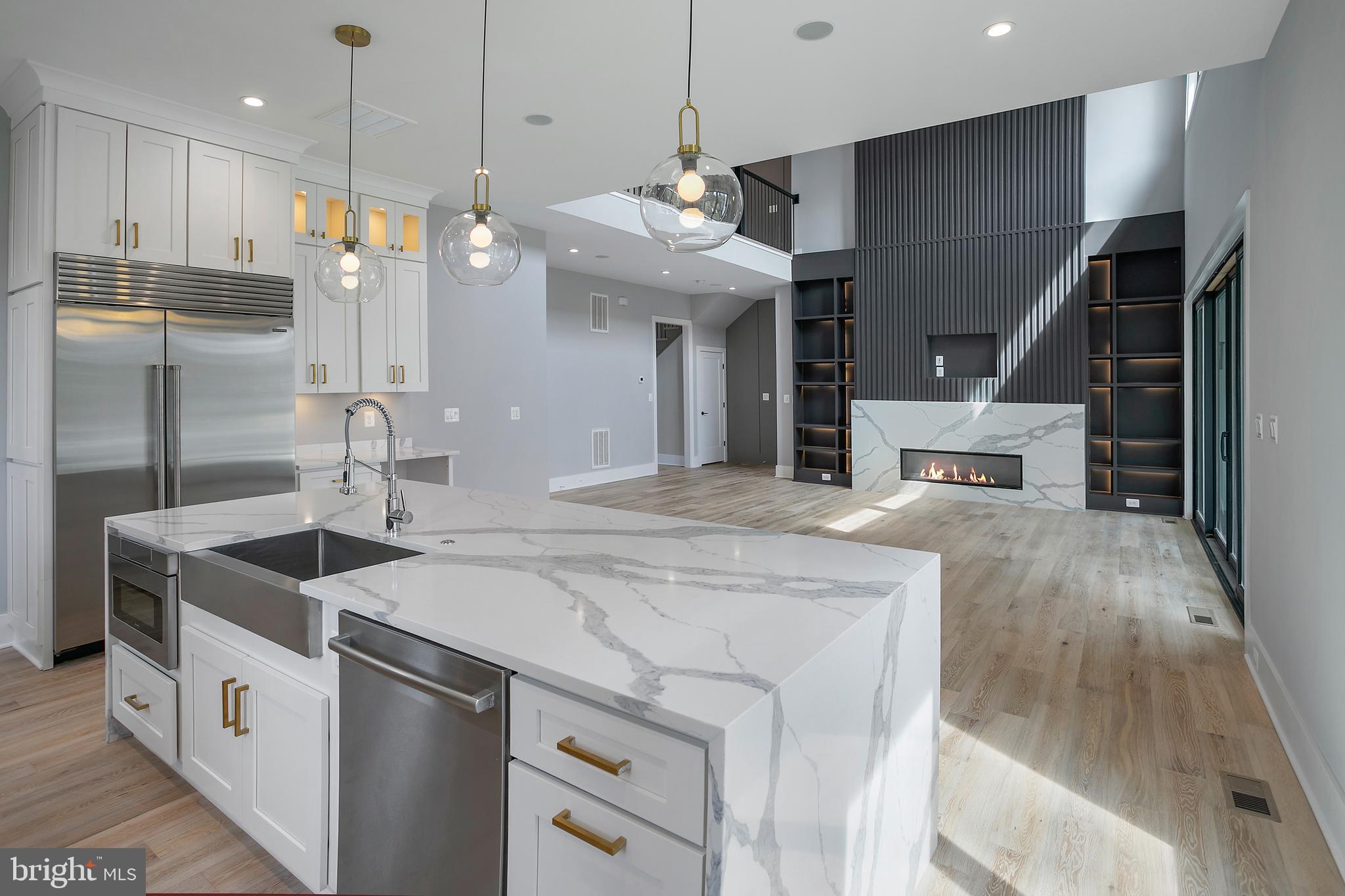 7019 Statendam Court McLean, VA 22101 - Photo 10 of 52 a kitchen with kitchen island a sink stainless steel appliances and cabinets