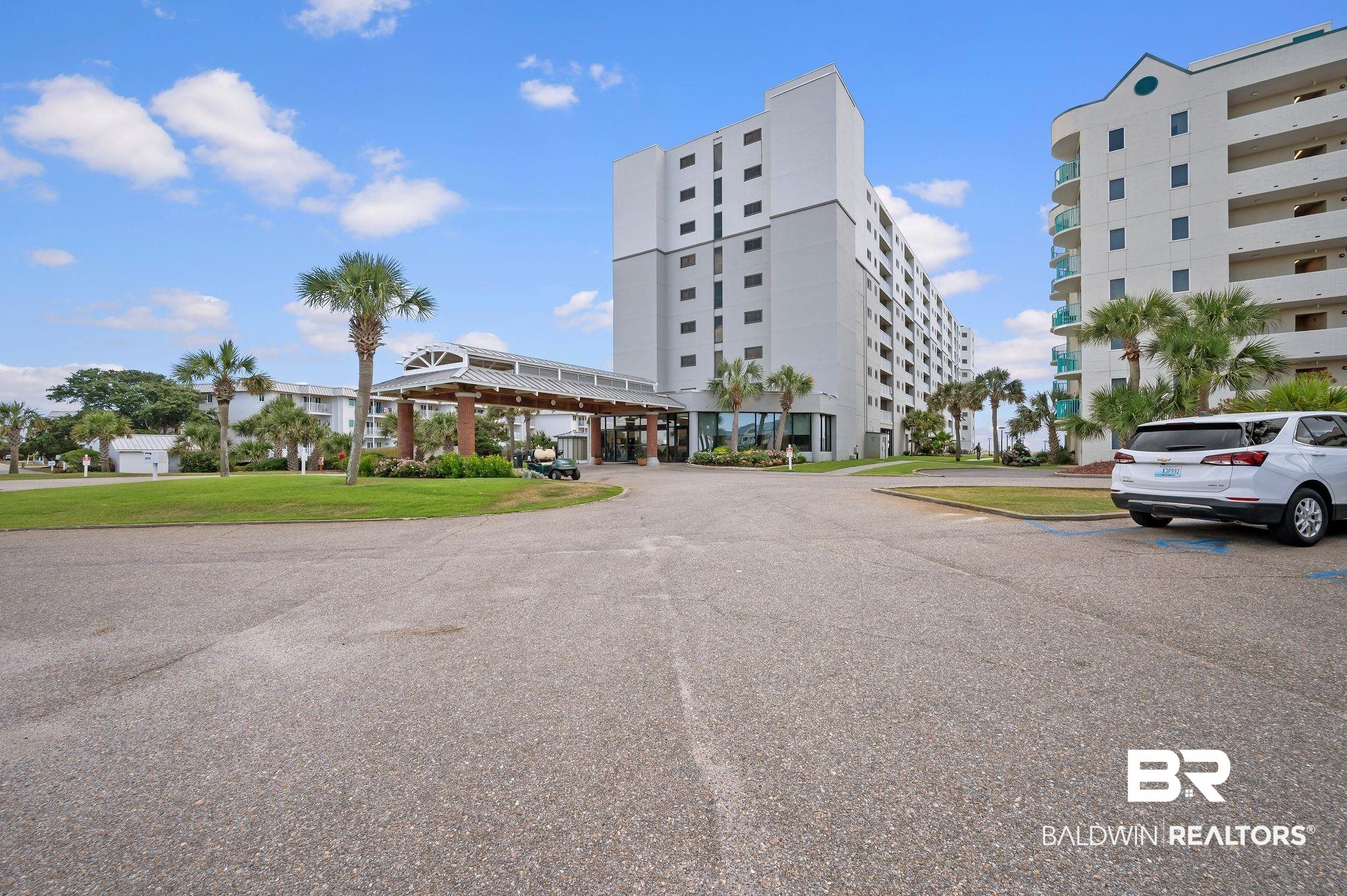 375 Plantation Road, Unit 5304 Gulf Shores, AL 36542 - Photo 1 of 42 View of building exterior featuring uncovered parking