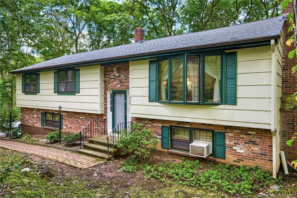 529 Maple Hill Road Guilford, CT 06437 - Photo 1 of 1 a front view of a house with garden