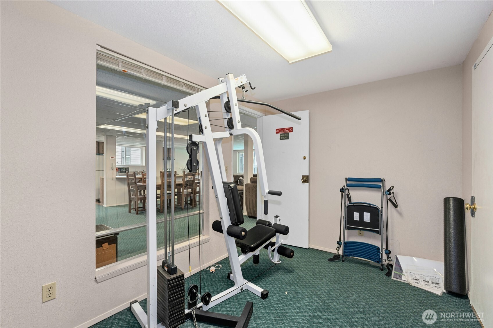 9523 Northeast 180th Street, Unit A102 Bothell, WA 98011 - Photo 28 of 29 a view of a room with gym equipment