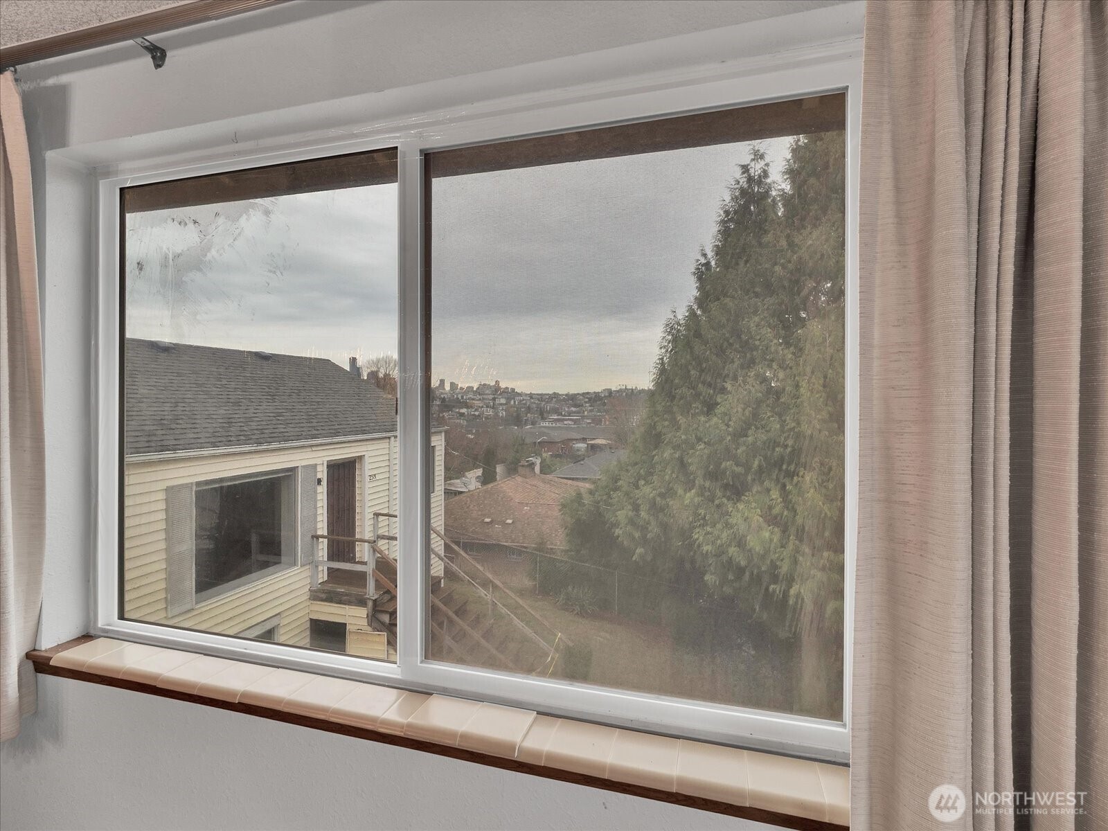 2523 23rd Avenue South Seattle, WA 98144 - Photo 11 of 29 a view of a room that has a large window with front door