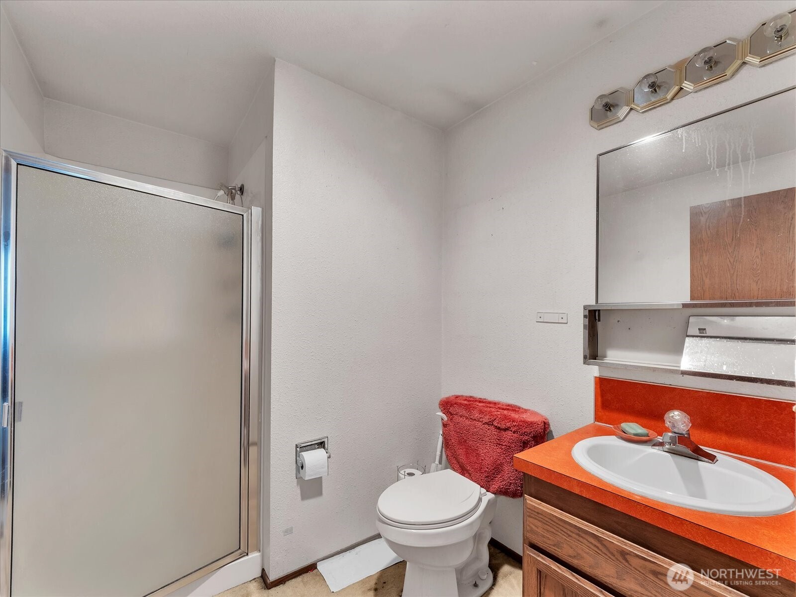 2523 23rd Avenue South Seattle, WA 98144 - Photo 13 of 29 a bathroom with a toilet sink and mirror