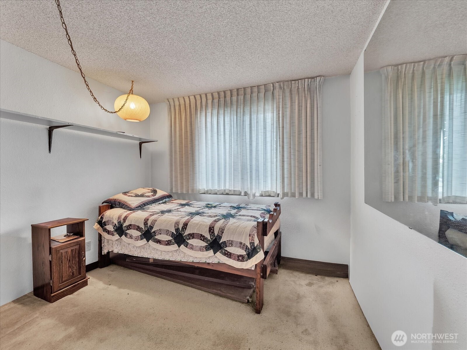 2523 23rd Avenue South Seattle, WA 98144 - Photo 14 of 29 a bedroom with a bed and a window