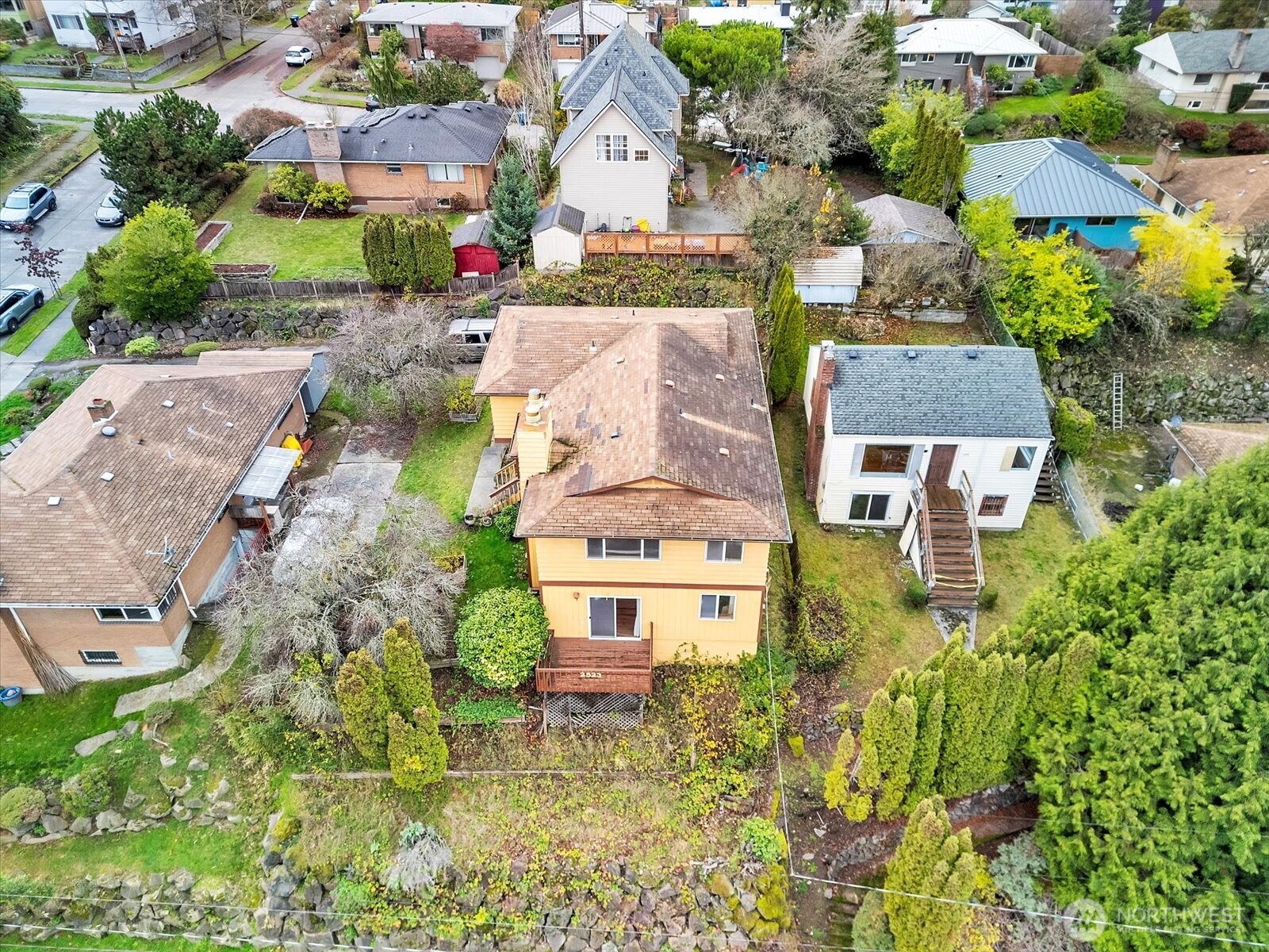 2523 23rd Avenue South Seattle, WA 98144 - Photo 2 of 29 an aerial view of a house with a yard and lake view