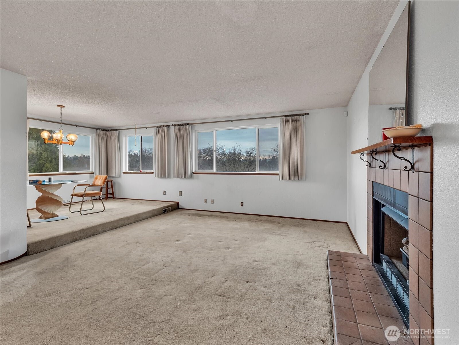 2523 23rd Avenue South Seattle, WA 98144 - Photo 7 of 29 an empty room with fireplace and windows