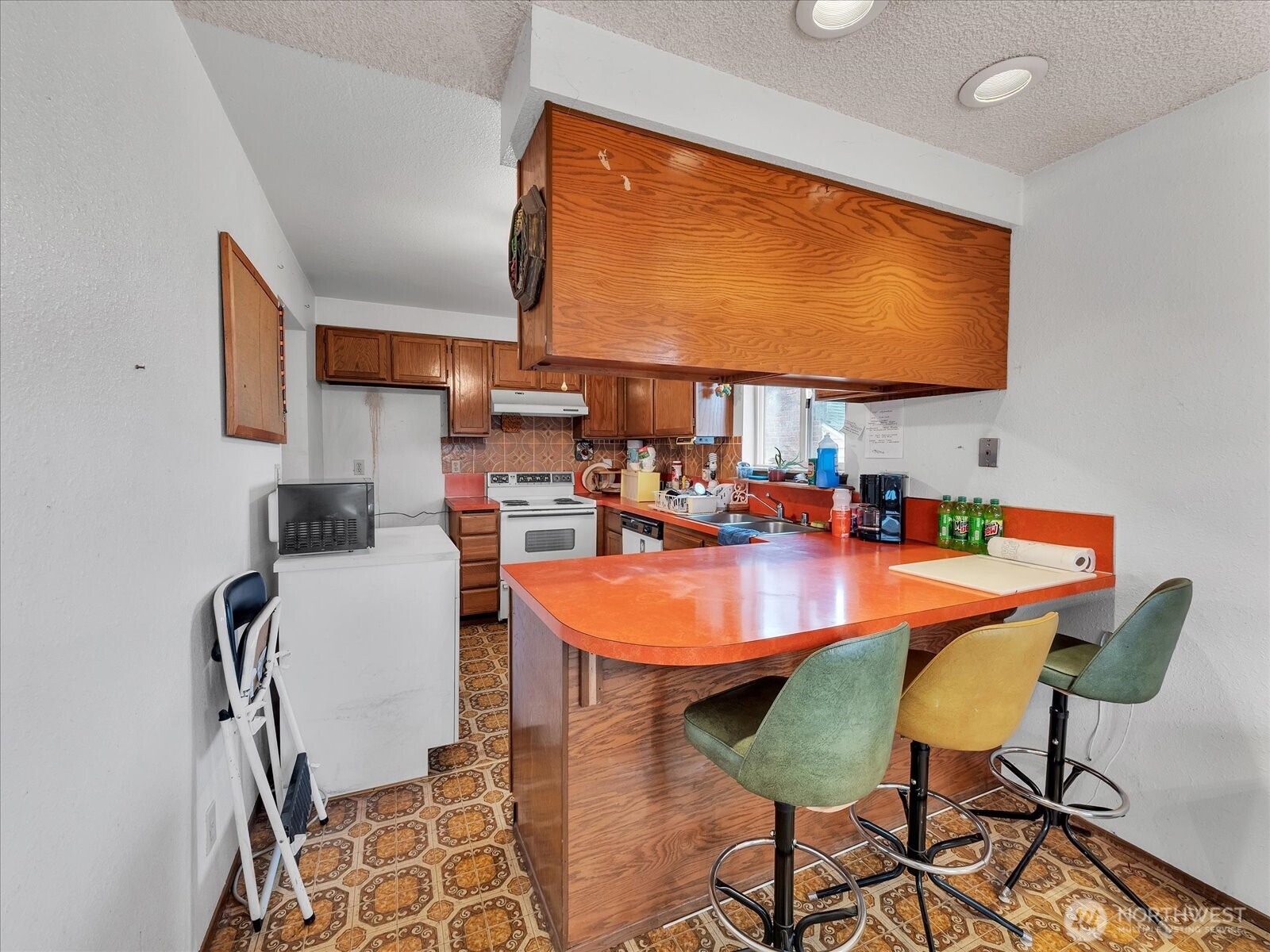2523 23rd Avenue South Seattle, WA 98144 - Photo 10 of 29 a dining room with furniture and a flat screen tv