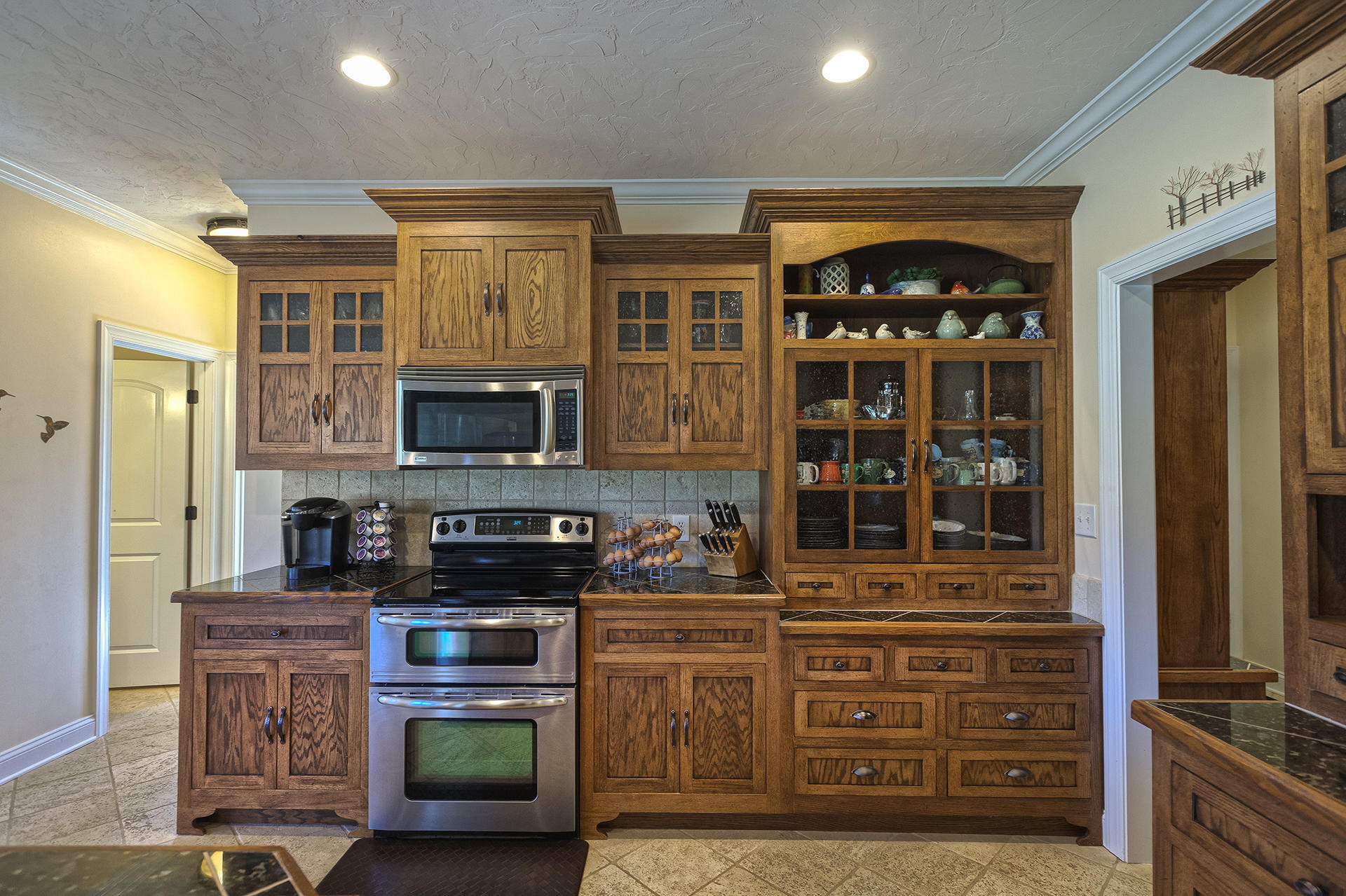5030 Bethlehem Road Boones Mill, VA 24065 - Photo 12 of 43 a kitchen with stainless steel appliances granite countertop a stove and cabinets