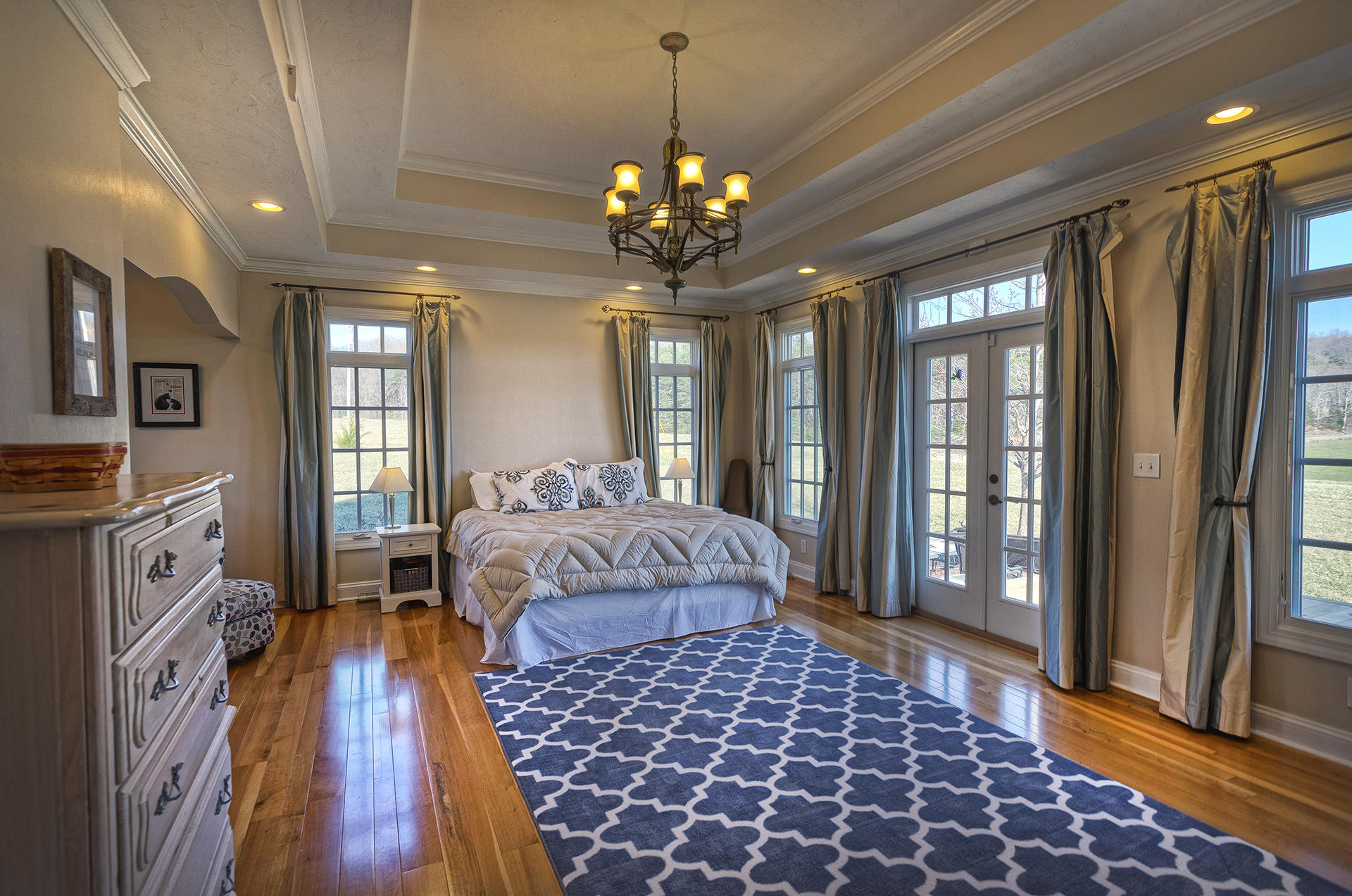 5030 Bethlehem Road Boones Mill, VA 24065 - Photo 17 of 43 a spacious bedroom with a bed dresser and a large window
