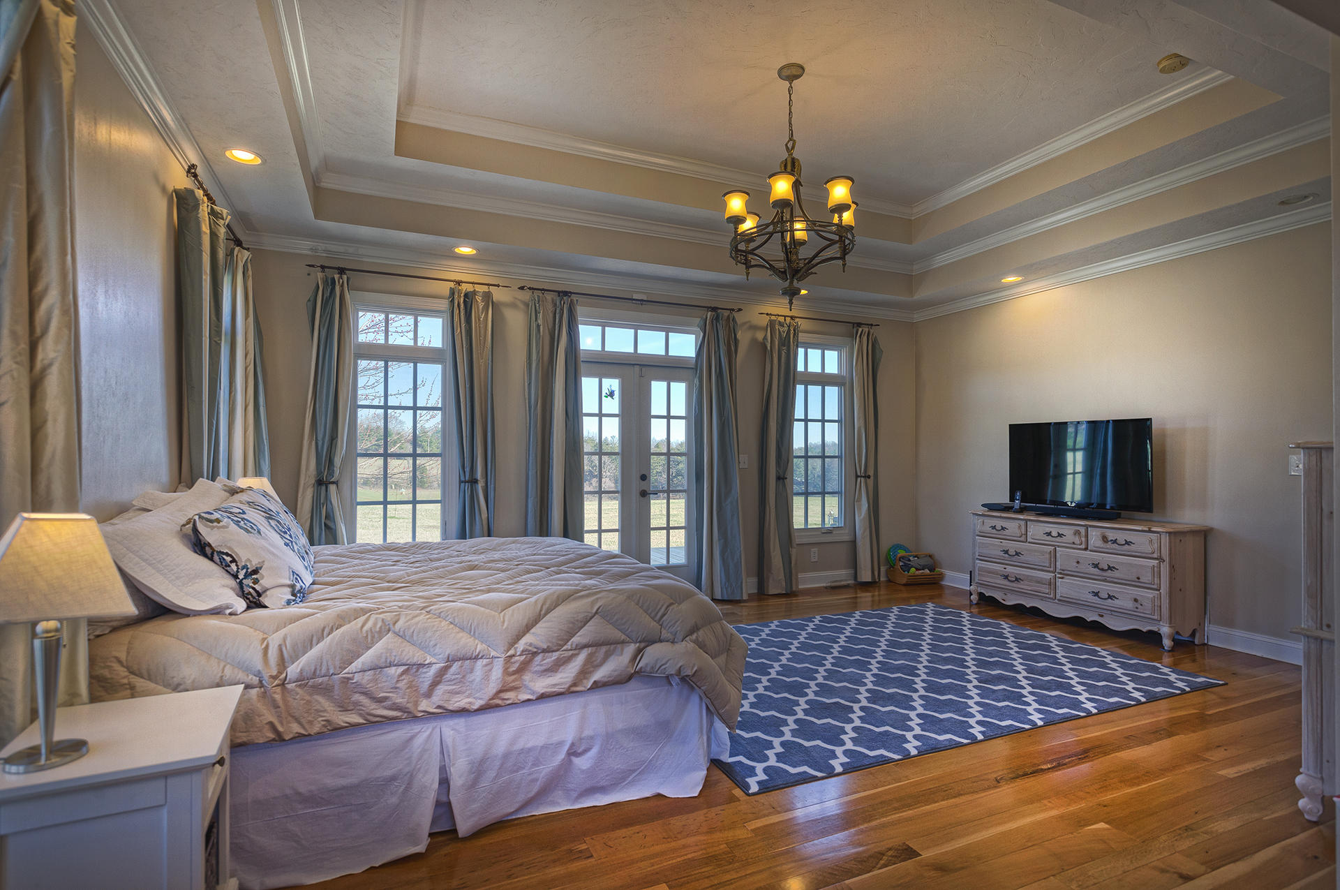 5030 Bethlehem Road Boones Mill, VA 24065 - Photo 20 of 43 a bedroom with a large bed and a flat screen tv