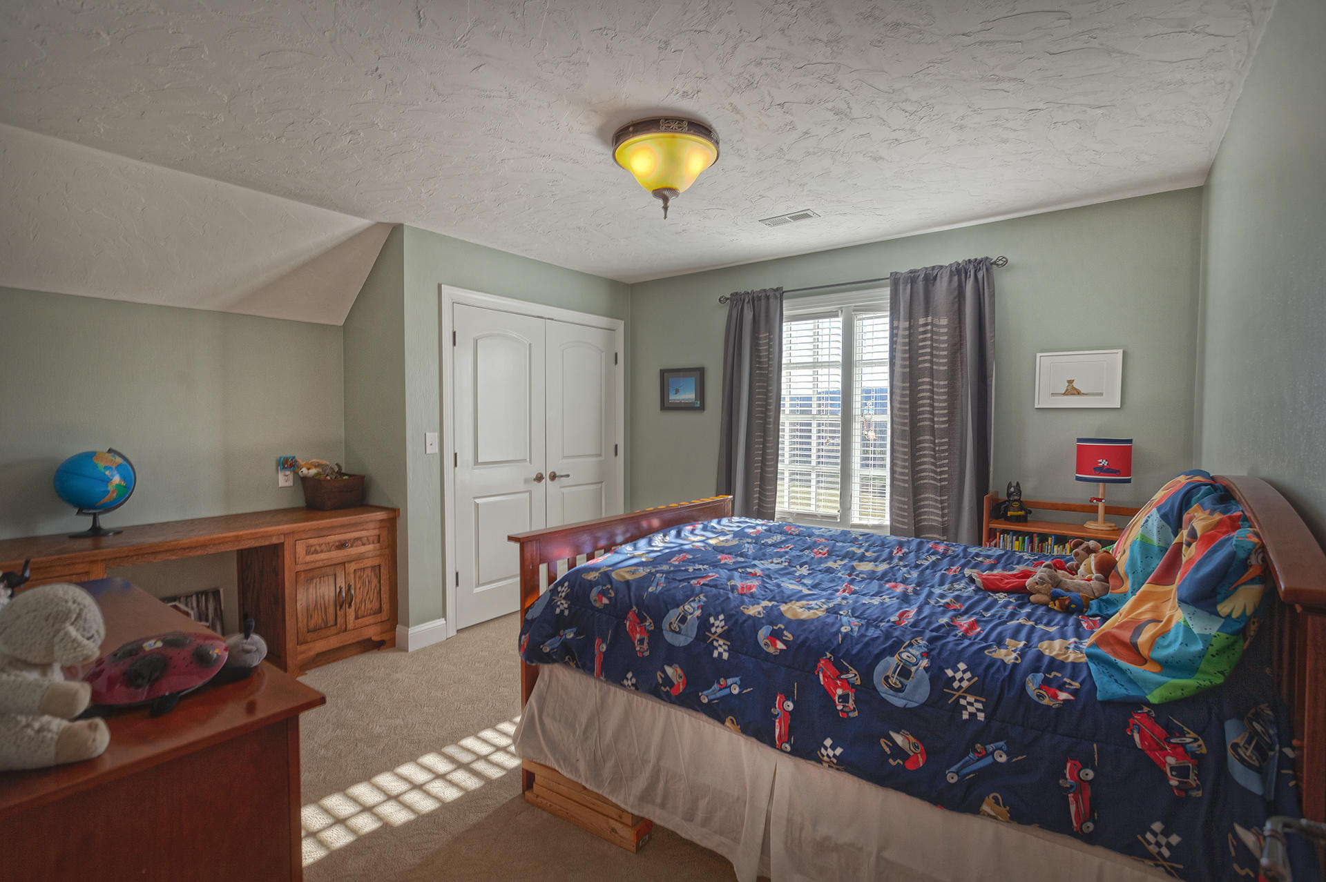 5030 Bethlehem Road Boones Mill, VA 24065 - Photo 25 of 43 a bedroom with a bed and a chandelier
