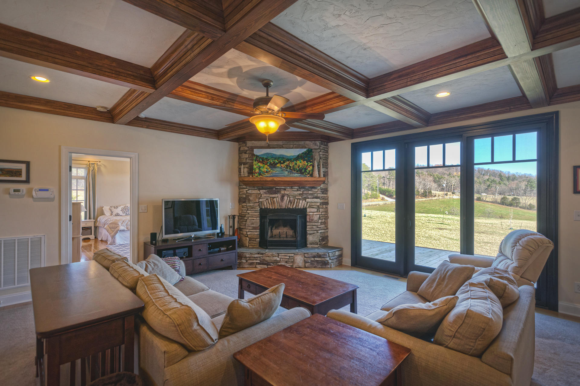 5030 Bethlehem Road Boones Mill, VA 24065 - Photo 6 of 43 a living room with furniture fireplace and a large window
