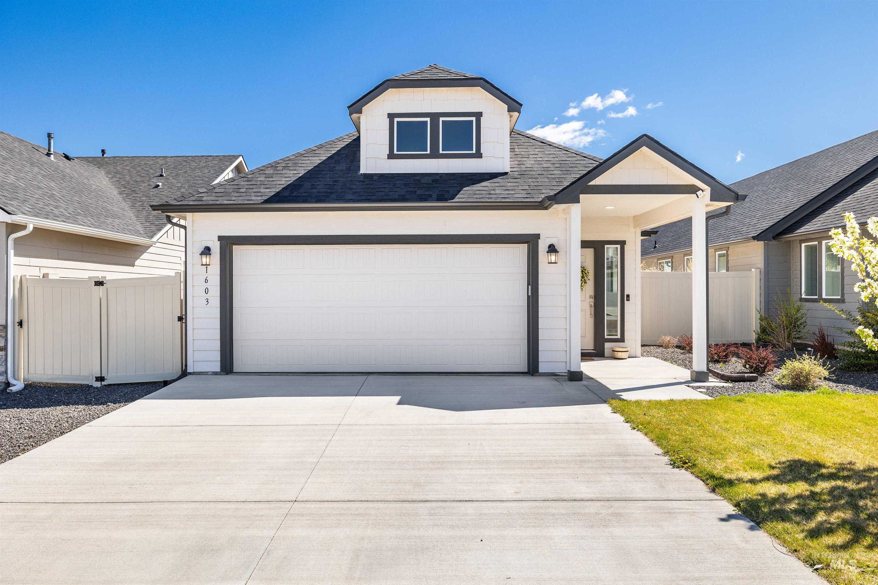 1603 Kenyon Mdw Street Twin Falls, ID 83301 - Photo 1 of 34 View of front of property featuring roof with shingles, driveway, a gate, and a garage