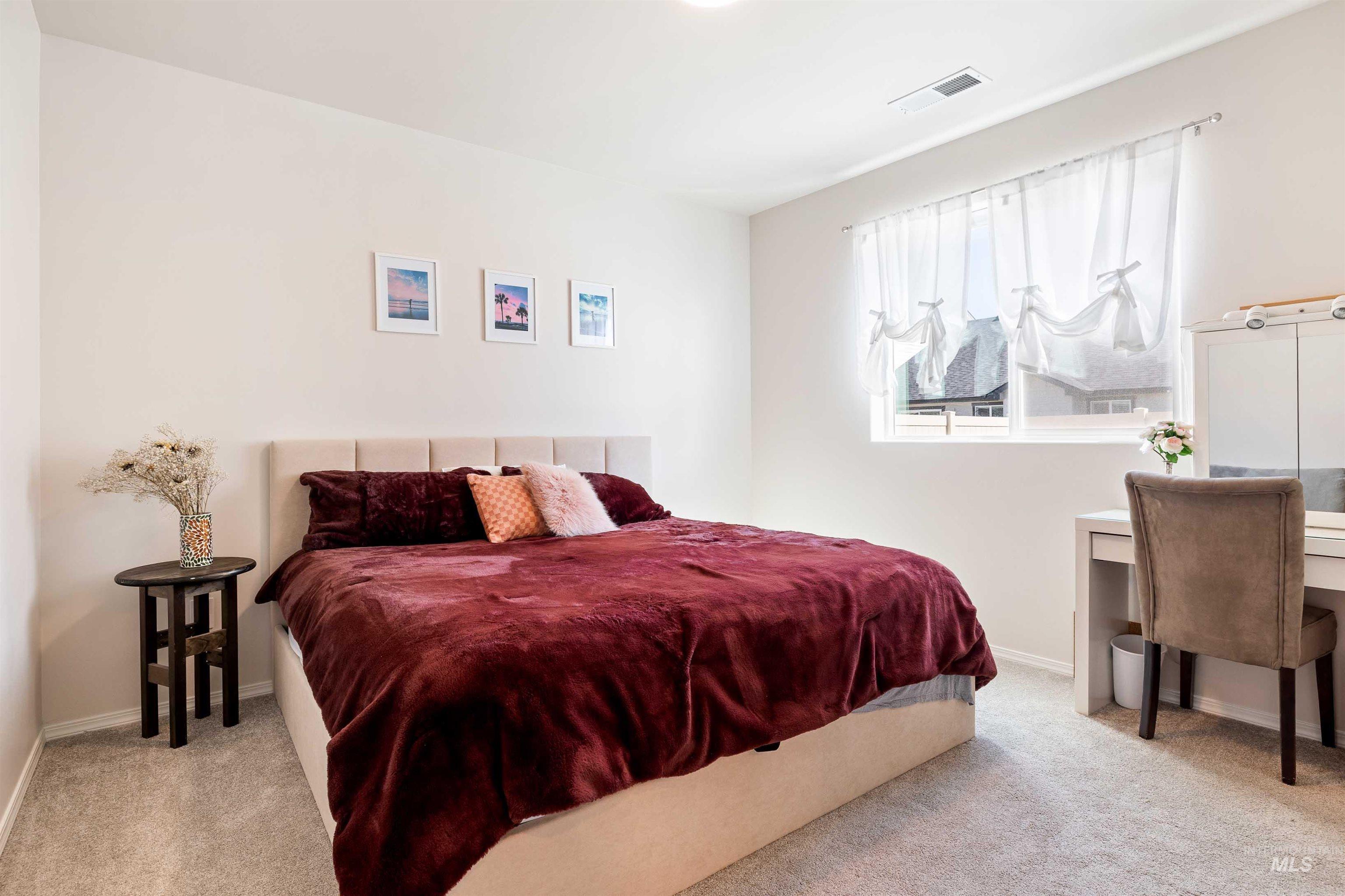 1603 Kenyon Mdw Street Twin Falls, ID 83301 - Photo 10 of 34 Bedroom with light colored carpet and an office area